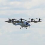 UK Unveils £46.5 Million In Initiative To Fast-Track Drones And Flying Taxis By 2028 SEO DES: The initiative improves regulations, enables wider drone use & strengthens airspace management while streamlining approvals for commercial drone operations SOCIAL: The United Kingdom has launched a £46.5 million funding package to speed up the development of drones and eVTOL aircraft, aiming to support commercial air mobility and flying taxi services by 2028. The initiative focuses on improving regulations, enabling wider drone use, and strengthening airspace management. Part of the funding will streamline approvals for commercial drone operations in sectors like emergency response, logistics, and infrastructure inspection. The rest will establish a national drone tracking system to enhance safety and prevent illegal drone activity. Officials said the move will boost the UK’s position in advanced air mobility, with strong industry support from firms like Vertical Aerospace, as the sector moves toward large-scale commercial deployment. London, United Kingdom: The United Kingdom has launched a major £46.5 million (US$63.3 million) funding initiative aimed at accelerating the deployment of drones and electric vertical take-off and landing (eVTOL) aircraft, marking one of the country’s largest commitments to advanced air mobility (AAM) and autonomous aviation technologies to date. The package, announced on May 5 by the Department for Transport (DfT), Home Office and the UK Civil Aviation Authority (CAA), seeks to streamline drone regulations, support commercial eVTOL operations and strengthen drone security enforcement across British airspace. Under the programme, £26.5 million will be allocated to the CAA to modernise and simplify regulatory approvals for commercial drone operations. The funding is intended to reduce administrative bottlenecks that have slowed industry growth and help integrate drones into routine public and commercial services including emergency response, medical logistics, infrastructure inspections and supply chain operations. The initiative also aims to establish the regulatory framework required to introduce commercial flying taxi services in the UK from 2028. Authorities said drone operators will gain access to a streamlined digital application system designed to significantly reduce approval timelines and improve operational scalability. The move aligns with the UK CAA’s eVTOL Delivery Model published in September 2025, which confirmed SC-VTOL as the certification basis for future air taxi aircraft and outlined operational provisions for both day and night flights under visual and instrument flight rules. The remaining £20.5 million will fund the development of the UK’s first national Hybrid Remote ID system for drones, effectively a digital “number plate” for unmanned aircraft. The technology will broadcast a drone’s identity and live location during flight, allowing nearby compatible receivers and authorised agencies to monitor operations in real time. The system will also maintain historical flight records through a secure online platform, enabling law enforcement agencies to identify and prosecute illegal or unsafe drone operators more efficiently. The government said the new identification network is aimed at addressing rising concerns surrounding rogue drone activity near airports, prisons, critical infrastructure and urban areas. Security Minister Dan Jarvis described the initiative as “a numberplate system for the skies,” adding that authorities would be able to identify operators violating aviation laws and remove illegal drones from UK airspace. UK Aviation, Maritime and Decarbonisation Minister Keir Mather said the investment would support British innovation while ensuring safety and public confidence remain central to the expansion of autonomous aviation technologies. He stated that the programme would “unlock barriers to growth,” create jobs, lower emissions and reinforce Britain’s position as a global aviation leader. Mather added that the advanced air mobility sector could contribute as much as £103 billion to the UK economy by 2050. Industry leaders welcomed the announcement, viewing it as a critical step toward scaling real-world commercial drone and eVTOL operations. Bristol-based eVTOL developer Vertical Aerospace said faster-moving regulation combined with high safety standards would be essential for the UK to lead the global advanced air mobility sector. The company’s VX4 eVTOL aircraft recently completed piloted transition flight testing as it progresses toward certification and commercial deployment targets later this decade. Autonomous cargo drone company Windracers also supported the reforms, stating that targeted investment and practical regulation were necessary to unlock large-scale autonomous aviation operations. The company highlighted its ULTRA drone platform, which is already being deployed in challenging operational environments including Ukraine and remote logistics missions across the Scottish Highlands and Islands. The funding package forms part of a broader UK aviation and decarbonisation strategy that includes £2.3 billion for green aircraft development programmes and an additional £63 million for sustainable aviation fuel (SAF) initiatives. Officials say the latest investment demonstrates the government’s intention to position Britain as an “aviation superpower” in next-generation aerospace technologies including drones, autonomous cargo aircraft and urban air mobility systems. While the announcement has been widely welcomed by industry stakeholders, analysts note that the UK still faces competition from the United States, China and the United Arab Emirates, all of which are investing aggressively in advanced air mobility ecosystems, certification frameworks and commercial eVTOL infrastructure. Nevertheless, the latest funding package is expected to accelerate Britain’s transition from experimental drone operations to routine commercial deployment over the coming years.
