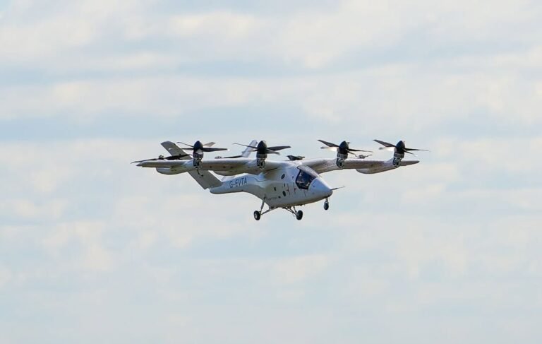 UK Unveils £46.5 Million In Initiative To Fast-Track Drones And Flying Taxis By 2028 SEO DES: The initiative improves regulations, enables wider drone use & strengthens airspace management while streamlining approvals for commercial drone operations SOCIAL: The United Kingdom has launched a £46.5 million funding package to speed up the development of drones and eVTOL aircraft, aiming to support commercial air mobility and flying taxi services by 2028. The initiative focuses on improving regulations, enabling wider drone use, and strengthening airspace management. Part of the funding will streamline approvals for commercial drone operations in sectors like emergency response, logistics, and infrastructure inspection. The rest will establish a national drone tracking system to enhance safety and prevent illegal drone activity. Officials said the move will boost the UK’s position in advanced air mobility, with strong industry support from firms like Vertical Aerospace, as the sector moves toward large-scale commercial deployment. London, United Kingdom: The United Kingdom has launched a major £46.5 million (US$63.3 million) funding initiative aimed at accelerating the deployment of drones and electric vertical take-off and landing (eVTOL) aircraft, marking one of the country’s largest commitments to advanced air mobility (AAM) and autonomous aviation technologies to date. The package, announced on May 5 by the Department for Transport (DfT), Home Office and the UK Civil Aviation Authority (CAA), seeks to streamline drone regulations, support commercial eVTOL operations and strengthen drone security enforcement across British airspace. Under the programme, £26.5 million will be allocated to the CAA to modernise and simplify regulatory approvals for commercial drone operations. The funding is intended to reduce administrative bottlenecks that have slowed industry growth and help integrate drones into routine public and commercial services including emergency response, medical logistics, infrastructure inspections and supply chain operations. The initiative also aims to establish the regulatory framework required to introduce commercial flying taxi services in the UK from 2028. Authorities said drone operators will gain access to a streamlined digital application system designed to significantly reduce approval timelines and improve operational scalability. The move aligns with the UK CAA’s eVTOL Delivery Model published in September 2025, which confirmed SC-VTOL as the certification basis for future air taxi aircraft and outlined operational provisions for both day and night flights under visual and instrument flight rules. The remaining £20.5 million will fund the development of the UK’s first national Hybrid Remote ID system for drones, effectively a digital “number plate” for unmanned aircraft. The technology will broadcast a drone’s identity and live location during flight, allowing nearby compatible receivers and authorised agencies to monitor operations in real time. The system will also maintain historical flight records through a secure online platform, enabling law enforcement agencies to identify and prosecute illegal or unsafe drone operators more efficiently. The government said the new identification network is aimed at addressing rising concerns surrounding rogue drone activity near airports, prisons, critical infrastructure and urban areas. Security Minister Dan Jarvis described the initiative as “a numberplate system for the skies,” adding that authorities would be able to identify operators violating aviation laws and remove illegal drones from UK airspace. UK Aviation, Maritime and Decarbonisation Minister Keir Mather said the investment would support British innovation while ensuring safety and public confidence remain central to the expansion of autonomous aviation technologies. He stated that the programme would “unlock barriers to growth,” create jobs, lower emissions and reinforce Britain’s position as a global aviation leader. Mather added that the advanced air mobility sector could contribute as much as £103 billion to the UK economy by 2050. Industry leaders welcomed the announcement, viewing it as a critical step toward scaling real-world commercial drone and eVTOL operations. Bristol-based eVTOL developer Vertical Aerospace said faster-moving regulation combined with high safety standards would be essential for the UK to lead the global advanced air mobility sector. The company’s VX4 eVTOL aircraft recently completed piloted transition flight testing as it progresses toward certification and commercial deployment targets later this decade. Autonomous cargo drone company Windracers also supported the reforms, stating that targeted investment and practical regulation were necessary to unlock large-scale autonomous aviation operations. The company highlighted its ULTRA drone platform, which is already being deployed in challenging operational environments including Ukraine and remote logistics missions across the Scottish Highlands and Islands. The funding package forms part of a broader UK aviation and decarbonisation strategy that includes £2.3 billion for green aircraft development programmes and an additional £63 million for sustainable aviation fuel (SAF) initiatives. Officials say the latest investment demonstrates the government’s intention to position Britain as an “aviation superpower” in next-generation aerospace technologies including drones, autonomous cargo aircraft and urban air mobility systems. While the announcement has been widely welcomed by industry stakeholders, analysts note that the UK still faces competition from the United States, China and the United Arab Emirates, all of which are investing aggressively in advanced air mobility ecosystems, certification frameworks and commercial eVTOL infrastructure. Nevertheless, the latest funding package is expected to accelerate Britain’s transition from experimental drone operations to routine commercial deployment over the coming years.