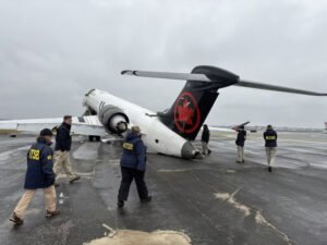 FAA Announces $16.5M Nationwide Airport Vehicle Transponder Plan After LaGuardia Crash SEO DES: Investigators found the fire truck lacked a transponder, preventing ASDE-X warnings before the crash that killed two pilots and injured dozens SOCIAL: The FAA will invest $16.5 million to equip around 1,900 airport vehicles at 264 U.S. airports with transponders following the deadly March 2026 Air Canada Express runway collision at New York’s LaGuardia Airport. Investigators found the airport fire truck involved lacked a transponder, preventing the ASDE-X safety system from detecting the vehicle and issuing a warning before the crash, which killed both pilots and injured dozens. The FAA says the new technology will improve runway safety, enhance surface tracking for controllers, and help prevent future runway incursions involving ground vehicles. Washington, United States: The Federal Aviation Administration (FAA) has announced a nationwide initiative to equip thousands of airport vehicles with transponders following the deadly March 2026 runway collision at New York’s LaGuardia Airport involving an Air Canada Express regional jet and an airport fire truck. The FAA said it will invest $16.5 million to install transponders on approximately 1,900 airport vehicles operating across 264 U.S. airports, aiming to strengthen runway safety and improve real-time surface tracking for air traffic controllers. The decision follows findings from the National Transportation Safety Board (NTSB) investigation into the March 22 collision between Air Canada Express Flight 8646, operated by Jazz Aviation, and a Port Authority fire truck at LaGuardia Airport. Investigators revealed that the fire truck involved in the accident was not equipped with a transponder, preventing the airport’s Advanced Surface Detection Equipment-X (ASDE-X) system from accurately tracking the vehicle and generating a collision warning for controllers. The Air Canada Express Bombardier CRJ900 had arrived from Montreal and was landing on Runway 4 when the fire truck crossed the active runway while responding to a separate emergency involving a United Airlines aircraft. Seconds before impact, controllers repeatedly instructed the vehicle to stop, but the aircraft collided with the truck during touchdown. Both pilots were killed, while dozens of passengers and crew members suffered injuries. According to preliminary NTSB findings, the ASDE-X runway safety system at LaGuardia failed to issue an automated alert warning controllers of the dangerous proximity between the aircraft and the vehicle. Investigators said the absence of a transponder on the fire truck was a significant factor in the system’s inability to detect and predict the vehicle’s movement. FAA Administrator Bryan Bedford said the deployment of transponder technology would help close critical gaps in airport surface surveillance and improve situational awareness for controllers operating at busy airports. The FAA added that airports can also use federal grant funding to install similar equipment on locally operated vehicles. More than 50 airports have already expressed interest in adopting the technology. The FAA’s plan covers vehicles operating at airports equipped with ASDE-X and related surface monitoring systems, which rely partly on transponder data to track aircraft and ground vehicles moving on runways and taxiways. Aviation safety experts have long advocated broader use of the technology to reduce runway incursions and prevent collisions involving airport vehicles. The Port Authority of New York and New Jersey had earlier confirmed plans to equip emergency response vehicles at LaGuardia, John F. Kennedy International Airport, and Newark Liberty International Airport with transponders following the accident.