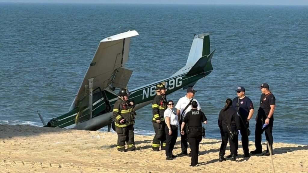 Ocean City, United States: A single-engine aircraft carrying two people made an emergency landing on a crowded beach in Ocean City on Monday evening after departing from the nearby municipal airport, according to emergency officials and multiple local media reports. The aircraft, identified as a 1970 Cessna 150K with registration N6129G, landed on the beach near 94th Street at approximately 5:30 p.m. local time. Officials confirmed that both occupants escaped without injuries and no beachgoers were harmed during the incident. According to the Ocean City Fire Department, firefighters and paramedics responded to reports of an “aircraft emergency” involving a Cessna 150 on the beach. Emergency responders evaluated the two people onboard at the scene, but neither required hospital transport. Local reports said the aircraft had departed from Ocean City Municipal Airport shortly before the emergency landing. Photographs from the scene showed the aircraft nose-down in the sand as emergency crews secured the area around the airplane. In a statement, officials said no fuel leak or fire occurred following the landing. The pilot was also able to avoid nearby people on the beach despite the busy evening conditions. Authorities established a safety perimeter while investigators began examining the aircraft. According to reporting by local television stations, the aircraft is registered to William E. Peters of Bel Air, Maryland. Investigators have not yet publicly confirmed the cause of the emergency landing, though authorities are expected to examine possible mechanical issues and pilot communications before releasing preliminary findings. The Maryland State Police confirmed an investigation is underway. Federal aviation authorities are also expected to review the incident as part of standard post-incident procedures involving emergency aircraft landings. Witnesses at the scene described seeing the aircraft descending unusually low over the shoreline moments before touching down on the sand. Emergency vehicles quickly arrived in the area as beachgoers gathered nearby while authorities secured the aircraft.