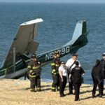 Ocean City, United States: A single-engine aircraft carrying two people made an emergency landing on a crowded beach in Ocean City on Monday evening after departing from the nearby municipal airport, according to emergency officials and multiple local media reports. The aircraft, identified as a 1970 Cessna 150K with registration N6129G, landed on the beach near 94th Street at approximately 5:30 p.m. local time. Officials confirmed that both occupants escaped without injuries and no beachgoers were harmed during the incident. According to the Ocean City Fire Department, firefighters and paramedics responded to reports of an “aircraft emergency” involving a Cessna 150 on the beach. Emergency responders evaluated the two people onboard at the scene, but neither required hospital transport. Local reports said the aircraft had departed from Ocean City Municipal Airport shortly before the emergency landing. Photographs from the scene showed the aircraft nose-down in the sand as emergency crews secured the area around the airplane. In a statement, officials said no fuel leak or fire occurred following the landing. The pilot was also able to avoid nearby people on the beach despite the busy evening conditions. Authorities established a safety perimeter while investigators began examining the aircraft. According to reporting by local television stations, the aircraft is registered to William E. Peters of Bel Air, Maryland. Investigators have not yet publicly confirmed the cause of the emergency landing, though authorities are expected to examine possible mechanical issues and pilot communications before releasing preliminary findings. The Maryland State Police confirmed an investigation is underway. Federal aviation authorities are also expected to review the incident as part of standard post-incident procedures involving emergency aircraft landings. Witnesses at the scene described seeing the aircraft descending unusually low over the shoreline moments before touching down on the sand. Emergency vehicles quickly arrived in the area as beachgoers gathered nearby while authorities secured the aircraft.