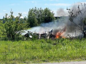 Missouri, United States: Twelve people, including a pilot and 11 skydivers, were killed when a skydiving aircraft crashed shortly after takeoff from Butler Memorial Airport in western Missouri on Sunday, marking one of the deadliest U.S. skydiving aviation accidents in recent years. The aircraft, identified by investigators as a Pacific Aerospace P750XL single-engine turboprop, was being operated by Skydive Kansas City and was carrying a group of skydivers for a scheduled jump flight when the accident occurred near Butler, a town located about 65 miles south of Kansas City. According to Skydive Kansas City, all 12 occupants onboard lost their lives in the crash. "Tragically, all 12 individuals aboard lost their lives in the accident," the company said in a statement, adding that victim identities would not be released until all next of kin had been notified. Dennis Jacobs, acting manager of Butler Memorial Airport and director of the Bates County Emergency Management Agency, said the aircraft departed at approximately 11:20 a.m. local time but appeared unable to climb normally after takeoff. Jacobs told reporters the airplane made a sharp left turn shortly after becoming airborne before crashing roughly 300 yards from the runway. "It had just taken off and made a left turn," Jacobs said. "In my opinion I think it was losing power, and he was trying to make it over to the highway and land, and he stalled and went down nose first and caught fire," he said. Witness accounts and local officials indicated the pilot may have been attempting an emergency landing near a nearby highway before the aircraft descended rapidly and impacted terrain. Authorities said the passengers were participating in a skydiving outing organized by Skydive Kansas City. According to reports, the group included experienced skydivers as well as tandem jump participants preparing for a recreational jump flight. Missouri Highway Patrol Sgt. Justin Ewing said emergency responders received reports of an aircraft down and engulfed in flames at approximately 11:30 a.m. The aircraft crashed in a field adjacent to the airport and was consumed by fire following impact. Emergency crews extinguished the blaze shortly afterward, but there were no survivors. One of the most tragic aspects of the accident was that several family members of those onboard reportedly witnessed the crash from the ground. Bates County Sheriff Chad Anderson said relatives were present at the airport when the aircraft went down. Clergy members, volunteers and grief counselors were mobilized to assist families at the scene while authorities worked to identify victims and notify relatives. Missouri Governor Mike Kehoe said multiple state agencies were responding to support local authorities and affected families."Our prayers are with the community and all those working to help," the governor said. The Federal Aviation Administration (FAA) and the National Transportation Safety Board (NTSB) have launched investigations into the accident. FAA officials arrived at the crash site Sunday, while an NTSB investigation team was scheduled to arrive Monday to begin documenting evidence, examining the wreckage and interviewing witnesses. The NTSB said a final report determining the probable cause of the accident could take between 12 and 24 months to complete. Authorities have not released any preliminary findings and stressed that the cause remains undetermined.