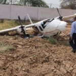 Bhiwani, India: India’s Aircraft Accident Investigation Bureau (AAIB) has released its final investigation report into the accident involving Tecnam P2006T aircraft VT-VDB operated by FSTC Flying School at Bhiwani Airfield, Haryana, on May 12, 2022, concluding that fuel vapor lock in the left engine, combined with crew handling deficiencies and limited experience on type, led to the crash during a training flight. The twin-engine Tecnam P2006T was conducting a routine training sortie at Chaudhary Bansi Lal Airport, Bhiwani, with a flight instructor and a student pilot on board. The exercise involved six circuit-and-landing maneuvers and was the second training sortie of the day. According to the investigation, the aircraft completed its first circuit and performed a normal touch-and-go landing on Runway 30. Shortly after becoming airborne again, the crew experienced rough running and a loss of power in the left engine. The instructor took control and initiated asymmetric-flight procedures to maintain directional control. While the aircraft was still climbing at approximately 100 feet above ground level, the crew reported roughness and a reduction in power from the right engine as well. As the aircraft’s airspeed decayed, it was unable to sustain the climb. The crew elected to conduct a forced landing within the airfield boundary. The aircraft touched down heavily, sustaining substantial damage before coming to rest near the perimeter wall. Both occupants evacuated safely. No fatalities, serious injuries, fire, or damage to third parties were reported. The accident aircraft was a 2019-built Tecnam P2006T, serial number 269, powered by two Rotax 912 S3 engines. Records examined by investigators showed the aircraft held valid airworthiness documentation and had been maintained in accordance with DGCA-approved maintenance programs. The 34-year-old flight instructor held a valid Commercial Pilot Licence and had accumulated approximately 1,589 flight hours. However, he had only around 28 hours of experience on the Tecnam P2006T type. The 20-year-old student pilot had logged approximately 182 flight hours, most of them on Cessna 172 aircraft. Prior to the accident, he had accumulated only about 1 hour and 15 minutes on the Tecnam P2006T. Investigators found both crew members were properly licensed, medically fit, adequately rested, and had not consumed alcohol. A central focus of the investigation was determining whether an engine malfunction had caused the accident. AAIB investigators conducted extensive examinations and operational testing of both Rotax engines and associated fuel, ignition, and electrical systems. The report concluded that neither engine suffered a technical malfunction and both were capable of producing power. Investigators also noted that the aircraft’s Garmin avionics system had the capability to record engine and flight parameters. However, no SD card had been installed in the data-logging slot, meaning no flight data was recorded. Subsequent attempts by the U.S. The National Transportation Safety Board (NTSB) to recover information from the units' internal memory was unsuccessful. Weather conditions at Bhiwani played a significant role in the occurrence. Meteorological data recorded temperatures of approximately 44°C at the time of the flight, while a weather station measured 46°C immediately after the accident. The aircraft type is approved for operations up to 50°C. Investigators determined that the combination of extreme ambient temperatures, elevated runway surface temperatures, and the use of automotive gasoline (MOGAS) created conditions favorable for vapor lock formation. Vapor lock occurs when fuel vaporizes within fuel lines, disrupting the continuous supply of liquid fuel to the engine. The report noted that FSTC operated its Tecnam fleet on MOGAS containing 10% ethanol. Although the fuel met all approved specifications and manufacturer requirements, investigators found that its volatility increased the likelihood of vapor formation under very hot operating conditions. According to the report, the student pilot switched off the aircraft’s electric fuel pumps after leveling at circuit altitude, following normal procedures. As the aircraft entered the circuit pattern and later prepared for the touch-and-go maneuver, engine power settings were reduced, resulting in lower fuel flow and reduced cooling airflow through the engine compartments. Following touchdown and the subsequent takeoff, investigators believe heat accumulated within the engine cowling area, allowing fuel vapor to form in the fuel lines supplying the left engine. The resulting vapor lock interrupted fuel flow, causing rough running and loss of power in the left engine. The right engine later experienced a reduction in performance under similar environmental conditions, though investigators found evidence indicating it continued producing power throughout the forced landing sequence. While acknowledging the instructor initially applied correct asymmetric-flight techniques after the left-engine power loss, the report found several critical procedures outlined in the Aircraft Flight Manual (AFM) were not followed. Investigators determined that the failed left-engine propeller was not feathered, creating additional aerodynamic drag. The landing gear also remained extended, further degrading aircraft performance. The report additionally concluded that the instructor did not lower the aircraft’s pitch attitude sufficiently to preserve airspeed after the initial engine failure. As a result, airspeed decayed below the aircraft’s minimum control speed (VMCA), reducing controllability and climb capability. AAIB stated that the crew likely interpreted the right engine’s reduced performance as a complete engine failure, although evidence suggested the engine was still producing power. The investigation further noted that neither a left-engine failure call nor a Mayday transmission was made to air traffic personnel. AAIB also identified several organizational shortcomings at the flying school. Investigators found that FSTC had reduced local circuit altitude from the DGCA-approved 1,500 feet to 700 feet without formally amending its Training and Procedures Manual or obtaining regulatory approval. The investigation additionally criticized the emergency checklist carried onboard, describing it as a small single-page document that did not clearly describe actions required during various emergency situations. Another finding noted that the school did not utilize the aircraft’s built-in Garmin data-recording capability, despite the system being available. The report concluded that the aircraft was airworthy, properly maintained, loaded within limits, and carrying sufficient fuel. AAIB determined that the ambient temperature was close to the aircraft’s operational limit and conducive to vapor lock formation. Investigators also found that both crew members had comparatively limited experience on the Tecnam P2006T and that emergency procedures were not followed precisely after the initial engine power loss. The final probable cause stated that the accident occurred when the left engine encountered vapor lock and the right engine suffered a slight loss of power while operating in temperatures near the aircraft’s operational limit. The aircraft subsequently impacted the ground during a forced landing. Contributing factors identified by AAIB included non-adherence to Aircraft Flight Manual procedures and the pairing of two crew members with limited experience handling emergency situations on the aircraft type.
