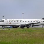 New Jersey, United States: An Air Canada Express flight bound for Halifax, Nova Scotia, was forced to divert to Boston on Wednesday after the aircraft’s captain suffered a serious medical emergency while the flight was airborne, prompting an emergency response from crew members, passengers and aviation authorities. The incident occurred aboard Air Canada Express Flight AC7664, operated by regional carrier PAL Airlines using a De Havilland Dash 8-400 (Q400) turboprop aircraft. According to Air Canada, the flight departed Newark Liberty International Airport in New Jersey at approximately 12:55 p.m. EDT on June 24 and was scheduled to operate a routine service to Halifax Stanfield International Airport in Nova Scotia. The aircraft was carrying 61 passengers. Air Canada said the captain experienced a medical issue during the flight and was removed from the flight deck in accordance with established safety procedures. The first officer immediately assumed control of the aircraft and initiated a diversion to Boston Logan International Airport. The airline emphasized that pilots are trained to safely operate and land aircraft independently if circumstances require. Flight-tracking data reviewed by multiple media outlets showed the aircraft had been airborne for roughly an hour when the diversion occurred. Data indicated the aircraft began descending approximately 30 minutes after departure before proceeding toward Boston. The flight, which normally takes about two hours and 15 minutes, did not continue to Halifax as planned. Passengers Describe Sudden Mid-Air Emergency. Several passengers later described a dramatic sequence of events inside the cabin. Passenger Rodney McDonald told ABC News that the situation became apparent when the aircraft suddenly swerved during flight. According to McDonald, the movement did not resemble turbulence and instead felt as though the flight controls had been abruptly disturbed multiple times. "The moment the plane swerved, I knew something was wrong because it was not turbulence," he told ABC News. McDonald said concern quickly spread through the cabin, with passengers fearing a potentially serious emergency. He recalled his children immediately beginning to pray as uncertainty grew over the aircraft's condition. The situation escalated when, according to passenger accounts, a flight attendant rushed into the cockpit before emerging with one of the pilots. McDonald said cabin crew members appeared to be struggling with the incapacitated pilot and requested assistance from passengers. Several travelers responded. Passenger Elizabeth Akinyemi told ABC News that the captain appeared to be suffering what looked like a seizure. She said the medical episode continued for approximately 40 minutes. Witnesses reported that the pilot displayed erratic behavior and at times attempted to return to the cockpit while experiencing the medical event. McDonald said he and approximately four other passengers helped crew members restrain the captain in the cabin while the first officer continued flying the aircraft toward Boston. No injuries among passengers were reported safe Landing In Boston. The first officer successfully diverted and landed the aircraft at Boston Logan International Airport at approximately 2 p.m. local time. The Federal Aviation Administration later confirmed that Air Canada Flight 7664 landed safely after the crew reported a pilot medical emergency. Massachusetts State Police said authorities were notified at approximately 1:37 p.m. that a crew member had suffered a medical emergency and that the aircraft was being flown by the co-pilot. State police patrol units and a marine unit responded as a precaution ahead of the aircraft's arrival. Television footage from Boston showed emergency vehicles surrounding the aircraft shortly after landing. Massport Fire Rescue personnel and Boston EMS crews met the aircraft on the runway. Video and aerial footage captured emergency responders bringing a stretcher to the aircraft before transporting the pilot from the airplane. The captain was subsequently taken to Massachusetts General Hospital for treatment. Officials have not publicly disclosed the pilot's identity, medical condition or the precise nature of the medical emergency. Passengers Continue Journey. Following the safe landing, Air Canada said it began making alternate travel arrangements for affected passengers. The passengers were expected to continue their journey to Halifax later the same day. The FAA has not announced any formal investigation beyond its standard review procedures associated with in-flight medical emergencies.