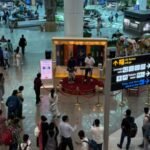 New Delhi, India: The Directorate General of Civil Aviation (DGCA) has intensified its warning against unauthorized photography and videography inside sensitive areas of airports across India, cautioning passengers that creating reels, vlogs, livestreams, or other social media content in restricted zones could attract serious penalties, including denial of boarding, confiscation of recording devices, and potential inclusion on a no-fly list in severe cases. The regulator's move comes amid a sharp rise in passengers documenting their travel experiences on social media platforms. According to reports, authorities have become increasingly concerned that seemingly harmless travel content may unintentionally capture sensitive security-related information, airport infrastructure, surveillance systems, operational procedures, or restricted facilities that are not meant for public dissemination. Under the restrictions, passengers are prohibited from conducting unauthorized photography or videography in security-sensitive areas of airports. These include security checkpoints, boarding areas, Security Hold Areas (SHA), runway buses, aircraft handling zones, airside operational areas, taxiways, and other restricted sections of airport infrastructure. Authorities say recording activities in such locations could compromise aviation security and operational safety. The DGCA's warning highlights that violations may result in a range of enforcement measures depending on the seriousness of the incident. Security personnel may direct passengers to stop filming, delete recorded material, or surrender devices for inspection. More serious violations could lead to fines, denial of boarding, security investigations, and recommendations for travel restrictions. Media reports indicate that repeat or severe offenders could face action under India's no-fly framework, although authorities have not yet released detailed criteria regarding how such cases would be evaluated. Officials have emphasized that the objective is not to prohibit all photography at airports but to prevent the disclosure of information that could pose security risks. The growing popularity of social media content creation has resulted in an increasing number of videos showing airport operations, security arrangements, access points, screening procedures, and other sensitive infrastructure. Aviation and security authorities believe such material could be exploited if widely circulated online. Airport authorities continue to permit photography in designated public areas where such activities are allowed. Passengers taking selfies or personal photographs in non-restricted terminal spaces are generally not the focus of the restrictions. However, travelers are being advised to carefully follow airport signage and instructions issued by security agencies, airline personnel, and airport operators before recording any content. The DGCA has also reiterated that commercial filming projects, promotional shoots, media productions, and influencer collaborations remain permissible only after obtaining the necessary approvals through authorized channels. Individuals and organizations seeking to conduct professional filming activities at airports must secure prior permissions in accordance with existing aviation and security regulations. The latest warning reflects a broader push by aviation authorities to strengthen security oversight across India's airport network as passenger traffic continues to grow. Regulators are urging travelers to exercise caution when creating content at airports and to avoid filming any area designated as restricted or security-sensitive.