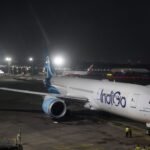 New Delhi, India: India’s aviation safety oversight framework will come under international scrutiny later this year as the United States Federal Aviation Administration (FAA) prepares to assess the Directorate General of Civil Aviation (DGCA) under its International Aviation Safety Assessment (IASA) programme in November. The review assumes heightened significance following a turbulent period for Indian aviation, marked by a series of operational disruptions, infrastructure failures and fatal accidents that have triggered concerns over the effectiveness of regulatory oversight in one of the world’s fastest-growing aviation markets. According to reports, the FAA assessment will examine whether the DGCA continues to meet international safety oversight standards established by the International Civil Aviation Organization (ICAO). The audit focuses on the capabilities of the regulator rather than the performance of individual airlines. The upcoming review follows what industry observers have described as one of the most challenging periods for Indian aviation in recent decades. Among the major events cited are the fatal Air India Boeing 787 crash in Ahmedabad, multiple helicopter accidents in Uttarakhand, a significant failure of Delhi’s air traffic control systems and the widespread operational disruption experienced by IndiGo in December 2025. The IndiGo disruption, one of the largest airline operational failures witnessed in India, resulted in the cancellation of 2,507 flights and delays to 1,852 services over a three-day period, affecting more than 300,000 passengers nationwide. A DGCA-appointed committee later identified over-optimisation of operations, inadequate regulatory preparedness, software deficiencies and shortcomings in management control as key contributing factors. The FAA review is particularly important because India currently holds Category 1 status under the IASA programme, allowing Indian carriers to operate and expand services to the United States. Retaining that rating is critical for airlines pursuing long-haul growth strategies, including Air India and IndiGo, both of which have announced ambitious international expansion plans. A downgrade could restrict Indian airlines from launching new services or increasing frequencies to the United States until deficiencies are corrected. India previously experienced such a setback in 2014 when the FAA downgraded the country’s safety rating over concerns related to regulatory staffing and oversight capability. The rating was restored after corrective measures were implemented. Government officials have publicly expressed confidence that India will retain its current status. However, industry experts note that the FAA assessment will take place against the backdrop of rapid aviation growth that has significantly increased demands on the regulator. India is currently among the fastest-expanding aviation markets globally, with airlines placing record aircraft orders and passenger traffic continuing to grow. This expansion has intensified concerns regarding inspector availability, surveillance capacity, technical expertise and the regulator’s ability to effectively oversee an increasingly complex aviation ecosystem. Recognising these challenges, the DGCA has initiated a series of corrective measures over the past year. These include enhanced surveillance activities, special safety audits, inspections of airlines and maintenance organisations, and stricter monitoring of airfield operators. Recently, the regulator directed operators of uncontrolled airstrips across the country to immediately review operational conditions and rectify any deficiencies affecting safety. The FAA’s assessment will evaluate multiple elements of India’s aviation oversight system, including aviation legislation, regulatory frameworks, personnel qualifications, technical guidance, certification processes, surveillance programmes and the resolution of safety concerns. The review will determine whether the DGCA possesses the resources, expertise and authority necessary to ensure compliance with international aviation safety standards. The outcome of the November review is expected to be closely watched by airlines, aircraft manufacturers, lessors and international aviation stakeholders. Beyond its immediate impact on air services between India and the United States, the assessment is widely viewed as a test of the strength and maturity of India’s aviation regulatory framework at a time when the country is positioning itself as a major global aviation hub.