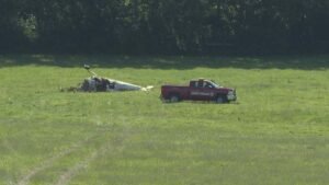 Nicholasville, United States: A Florida couple was killed after an experimental aircraft crashed into a farm in central Kentucky just minutes after departing Blue Grass Airport on Saturday, June 20, with federal investigators continuing to examine what caused the fatal accident. The victims have been identified as Brian Tonner, 72, and Karen Tonner, 71, according to the Jessamine County Coroner's Office. Coroner Michael Hughes said the married couple, both residents of Florida, were traveling home when the crash occurred on June 20. Authorities said Brian Tonner was piloting a Comp Air CA-6 experimental aircraft while Karen Tonner was onboard as a passenger. The aircraft departed Blue Grass Airport in Lexington at approximately 8:40 a.m. local time and crashed about six minutes later on a farm near Kentucky Route 169, between U.S. 27 and U.S. 68 in Jessamine County, south of Nicholasville. Emergency crews responded shortly after receiving reports of an aircraft accident in the rural area. Both occupants were pronounced dead at the scene. According to flight-tracking data, the aircraft traveled roughly 10 miles after departure and reached an altitude of approximately 3,300 feet before radar contact was lost. Investigators have not determined what caused the aircraft to go down. The aircraft involved was identified as a Comp Air CA-6, an experimental, amateur-built aircraft. Aviation records list the airplane as registration N82BT. The National Transportation Safety Board (NTSB) launched an investigation immediately following the crash. Investigators spent several days documenting the wreckage and collecting evidence from the crash site. The agency said investigators are reviewing multiple factors, including the pilot's flight experience, the aircraft's maintenance and operational history, weather conditions at the time of the accident, air traffic control information, radar data, and witness statements. Officials have not indicated whether the aircraft experienced a mechanical issue before impact. The NTSB said the wreckage will be transported to a secure facility for a more detailed examination once on-site documentation is completed. Witnesses reported seeing the aircraft shortly before it crashed, and investigators are continuing to gather statements and any available video footage from the area. The FAA is assisting the NTSB in the investigation. No preliminary cause has been released, and officials cautioned that determining the circumstances behind the crash could take months. A preliminary NTSB report is expected within the coming weeks, while a final report identifying the probable cause of the accident may take considerably longer. The crash remains under investigation.