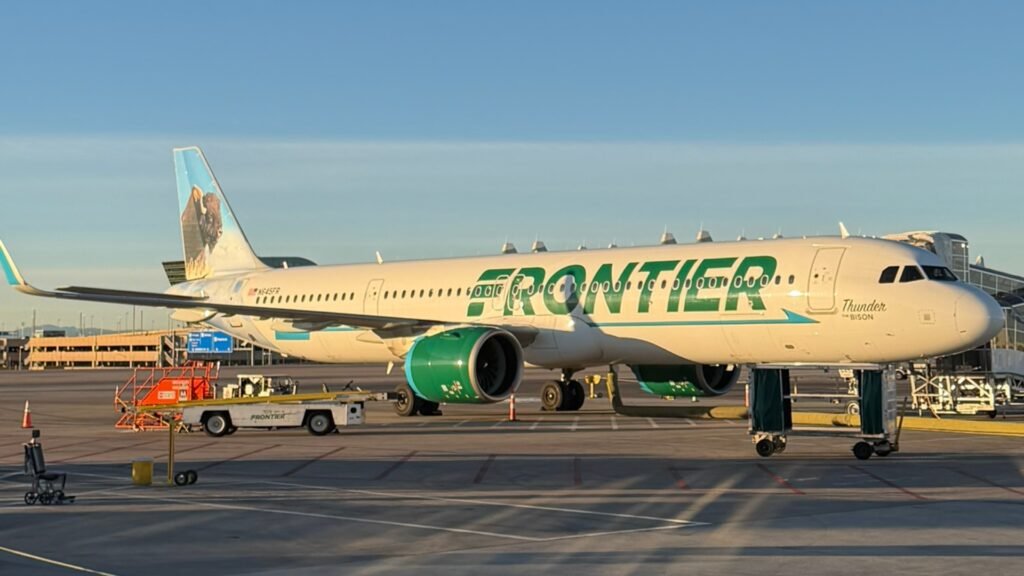 Miami, United States: A Frontier Airlines flight bound for Chicago was forced to divert to Miami after a passenger allegedly attempted to open an emergency exit door, tried to access the cockpit area, assaulted an off-duty flight attendant, and repeatedly disrupted the flight, according to law enforcement authorities and court documents. The incident occurred aboard Frontier Airlines Flight 3345, which departed San Juan, Puerto Rico, and was en route to Chicago O'Hare International Airport on May 31. Authorities identified the passenger as Juan Gabriel Reyes, 51, of Pahokee, Florida. According to an arrest report cited by Miami-Dade Sheriff's Office investigators, Reyes began causing disturbances approximately 45 minutes after takeoff. Authorities said he attempted to open one of the aircraft's emergency exit doors while the Airbus was in flight, reportedly telling crew members that he wanted to leave the aircraft. Flight attendants intervened and instructed Reyes to return to his seat. However, investigators said he ignored repeated crew commands and continued behaving erratically. The arrest affidavit states that Reyes then moved toward the front of the aircraft and allegedly attempted to gain access to the cockpit area by aggressively pushing against the flight deck door with his shoulder. After crew members escorted him away from the cockpit area, Reyes requested permission to use the lavatory. Authorities said he was allowed to do so but allegedly attempted to urinate on the restroom floor, creating another disturbance onboard. Due to his continued disruptive behavior, flight attendants relocated Reyes to another seat. An off-duty Frontier Airlines flight attendant volunteered to sit nearby and assist in monitoring him during the remainder of the flight. According to investigators, the off-duty employee later left his seat and placed his bag nearby before heading toward the lavatory. Another passenger reportedly alerted him that Reyes was attempting to take the bag. When the employee confronted Reyes, authorities allege that Reyes grabbed him and placed him in a chokehold, prompting an immediate response from passengers and crew members. Video recorded by passengers and widely circulated on social media showed multiple travelers and flight attendants struggling to restrain Reyes as chaos unfolded inside the cabin. Among those who intervened was Josh Longood, a former professional mixed martial arts fighter and Brazilian Jiu-Jitsu black belt. Longood assisted crew members and passengers in subduing Reyes and securing him using flex cuffs, zip ties, and seatbelt extenders. Court documents indicate that Reyes managed to break free from restraints multiple times, requiring passengers and crew to continue physically holding him down until the aircraft landed. The Federal Aviation Administration confirmed that the flight crew reported a passenger disturbance and diverted the aircraft to Miami International Airport as a precaution. Flight 3345 landed safely at approximately 11:55 a.m. local time in Miami, where Miami-Dade Sheriff's Office deputies boarded the aircraft and removed Reyes from the plane. Authorities initially charged Reyes with battery in connection with the alleged assault on the off-duty flight attendant. He was booked into the Miami-Dade jail and held on a reported $20,000 bond. According to court records cited by the Miami Herald, Reyes was later turned over to FBI agents for potential federal prosecution. Investigators indicated he could face additional federal charges, including interference with a flight crew and assault within maritime and territorial jurisdiction. No injuries requiring hospitalization were reported among passengers or crew. Frontier Airlines confirmed that law enforcement officers met the aircraft upon arrival in Miami and removed the disruptive passenger. Following the incident, the flight later resumed its journey to Chicago O'Hare International Airport. The FAA said it is aware of the incident and the investigation remains ongoing.