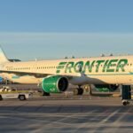 Miami, United States: A Frontier Airlines flight bound for Chicago was forced to divert to Miami after a passenger allegedly attempted to open an emergency exit door, tried to access the cockpit area, assaulted an off-duty flight attendant, and repeatedly disrupted the flight, according to law enforcement authorities and court documents. The incident occurred aboard Frontier Airlines Flight 3345, which departed San Juan, Puerto Rico, and was en route to Chicago O'Hare International Airport on May 31. Authorities identified the passenger as Juan Gabriel Reyes, 51, of Pahokee, Florida. According to an arrest report cited by Miami-Dade Sheriff's Office investigators, Reyes began causing disturbances approximately 45 minutes after takeoff. Authorities said he attempted to open one of the aircraft's emergency exit doors while the Airbus was in flight, reportedly telling crew members that he wanted to leave the aircraft. Flight attendants intervened and instructed Reyes to return to his seat. However, investigators said he ignored repeated crew commands and continued behaving erratically. The arrest affidavit states that Reyes then moved toward the front of the aircraft and allegedly attempted to gain access to the cockpit area by aggressively pushing against the flight deck door with his shoulder. After crew members escorted him away from the cockpit area, Reyes requested permission to use the lavatory. Authorities said he was allowed to do so but allegedly attempted to urinate on the restroom floor, creating another disturbance onboard. Due to his continued disruptive behavior, flight attendants relocated Reyes to another seat. An off-duty Frontier Airlines flight attendant volunteered to sit nearby and assist in monitoring him during the remainder of the flight. According to investigators, the off-duty employee later left his seat and placed his bag nearby before heading toward the lavatory. Another passenger reportedly alerted him that Reyes was attempting to take the bag. When the employee confronted Reyes, authorities allege that Reyes grabbed him and placed him in a chokehold, prompting an immediate response from passengers and crew members. Video recorded by passengers and widely circulated on social media showed multiple travelers and flight attendants struggling to restrain Reyes as chaos unfolded inside the cabin. Among those who intervened was Josh Longood, a former professional mixed martial arts fighter and Brazilian Jiu-Jitsu black belt. Longood assisted crew members and passengers in subduing Reyes and securing him using flex cuffs, zip ties, and seatbelt extenders. Court documents indicate that Reyes managed to break free from restraints multiple times, requiring passengers and crew to continue physically holding him down until the aircraft landed. The Federal Aviation Administration confirmed that the flight crew reported a passenger disturbance and diverted the aircraft to Miami International Airport as a precaution. Flight 3345 landed safely at approximately 11:55 a.m. local time in Miami, where Miami-Dade Sheriff's Office deputies boarded the aircraft and removed Reyes from the plane. Authorities initially charged Reyes with battery in connection with the alleged assault on the off-duty flight attendant. He was booked into the Miami-Dade jail and held on a reported $20,000 bond. According to court records cited by the Miami Herald, Reyes was later turned over to FBI agents for potential federal prosecution. Investigators indicated he could face additional federal charges, including interference with a flight crew and assault within maritime and territorial jurisdiction. No injuries requiring hospitalization were reported among passengers or crew. Frontier Airlines confirmed that law enforcement officers met the aircraft upon arrival in Miami and removed the disruptive passenger. Following the incident, the flight later resumed its journey to Chicago O'Hare International Airport. The FAA said it is aware of the incident and the investigation remains ongoing.