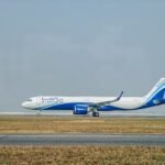 New Delhi, India: India's largest airline, IndiGo, has begun trial operations of an artificial intelligence-powered flight optimisation system aimed at reducing fuel consumption during one of the most fuel-intensive phases of flight take-off and climb. The airline has started testing SITA's OptiClimb solution across its Airbus fleet from June 25, marking a significant step in the adoption of advanced digital technologies to improve operational efficiency, reduce fuel burn, and lower carbon emissions. The initiative comes at a time when airlines worldwide are facing mounting pressure from rising fuel costs, sustainability targets, and increasing operational expenses. Fuel remains one of the largest cost components for airlines, making even small efficiency gains highly valuable across large fleets. Developed by aviation technology provider SITA, OptiClimb uses artificial intelligence, machine learning, aircraft-specific performance data, operational parameters, and real-time weather information to recommend the most fuel-efficient climb profile for each flight. Traditionally, aircraft follow relatively fixed climb procedures after take-off. Under the new system, pilots receive tailored speed recommendations based on factors such as aircraft weight, cruise altitude, atmospheric conditions, and actual aircraft performance. The objective is to optimise the climb phase without compromising safety or operational requirements. According to reports, the climb segment is among the most fuel-intensive portions of a flight because aircraft engines operate at high thrust settings during ascent. By adjusting climb speeds based on real-time conditions rather than relying solely on standard profiles, airlines can reduce fuel consumption significantly. IndiGo estimates the technology could save approximately 60 to 65 kilograms of fuel on every take-off. While the savings may appear modest on an individual flight, the impact becomes substantial when multiplied across thousands of daily operations. With IndiGo operating the largest fleet and flight network in India, cumulative annual fuel savings could translate into considerable reductions in operating costs and carbon emissions. The airline has reportedly spent several months working with SITA to integrate and prepare the system before launching operational trials. The move reflects a broader shift within the aviation industry toward data-driven flight optimisation. SITA's OptiFlight platform, which includes the OptiClimb module, is already used by airlines around the world to improve fuel efficiency during various phases of flight. According to SITA, the platform supports more than 2,500 aircraft globally and can help airlines reduce fuel consumption and emissions through aircraft-specific performance modelling, machine learning, and advanced weather forecasting. The technology forms part of a wider industry effort to achieve sustainability targets while mitigating the financial impact of volatile fuel prices. The adoption of AI-driven optimisation comes as Indian airlines continue to manage elevated aviation turbine fuel (ATF) costs. In recent months, carriers including IndiGo and Air India have adjusted capacity and schedules amid higher fuel prices and changing market conditions. Air India Group has already deployed SITA's OptiFlight climb optimisation technology and SITA eWAS weather solutions across portions of its fleet. The airline previously stated that the deployment could help save approximately 11,100 tonnes of fuel annually while reducing carbon emissions by around 35,000 tonnes per year. Industry experts believe AI-powered flight optimisation tools will increasingly become standard across commercial aviation as airlines seek to balance operational efficiency, environmental commitments, and profitability. For IndiGo, the OptiClimb trials represent another step in its ongoing efforts to improve fuel efficiency through technology and operational innovation. The carrier has historically implemented multiple fuel-saving initiatives, ranging from operational procedures to ground-efficiency measures. If the trials deliver the expected results, the airline could expand the technology across its Airbus fleet, potentially generating substantial long-term savings while supporting its sustainability objectives. As aviation enters a more data-driven era, artificial intelligence is increasingly moving from the back office into the cockpit, helping airlines make real-time operational decisions that directly influence fuel consumption, costs, and environmental performance.
