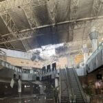 Kuwait International Airport suffered severe damage after an Iranian drone strike hit Terminal 1 on June 3, 2026, killing one person and injuring dozens in one of the most serious attacks on civilian aviation infrastructure in the Gulf since the outbreak of the regional conflict earlier this year. According to Kuwaiti authorities, the attack occurred during a broader wave of Iranian missile and drone launches targeting Kuwait and other Gulf states. The strike damaged large sections of Terminal 1, forcing flight diversions, temporary suspension of airport operations and emergency response measures across the airport complex. Kuwait's Directorate General of Civil Aviation (DGCA) later released CCTV footage showing the moment of impact. The video released by officials appears to show a delta-wing drone striking the terminal before a large explosion erupts, sending debris, smoke and flames through parts of the building. Aviation officials said the footage was released after emergency teams secured the affected areas and initial damage assessments were completed. Authorities reported that one person was killed and at least 63 others were injured. Emergency responders treated victims at the scene while firefighters worked to contain fires sparked by the attack. The DGCA said Terminal 1 sustained extensive structural damage, including collapsed ceiling sections, shattered glass and damage to airport facilities. Flight operations were temporarily disrupted, with several aircraft diverted to alternate airports. Kuwait Airways suspended scheduled services before later resuming limited operations from Terminal 4 following safety inspections and operational assessments. The strike came hours after a sharp escalation between Iran and the United States. U.S. forces reportedly conducted military action against Iranian targets, including facilities on Qeshm Island and maritime assets linked to Tehran. Iranian officials subsequently launched retaliatory missile and drone attacks against multiple locations across the Gulf region. U.S. Central Command stated that several Iranian missiles aimed at Kuwait and Bahrain either malfunctioned, fell short or were intercepted. Military officials also reported that additional drones targeting U.S. forces in Kuwait failed to reach their intended objectives. Kuwaiti officials condemned the attack, describing it as a violation of national sovereignty and an assault on civilian infrastructure. The country's Foreign Ministry said the strikes targeted civilian facilities, including the international airport, and warned that such actions threatened regional stability and aviation safety. The attack represents the latest incident involving Kuwait International Airport during the wider Iran-related conflict. Earlier drone attacks during the spring damaged airport infrastructure, fuel facilities and radar systems, prompting prolonged disruptions and temporary airport closures. Although operations gradually resumed following an April ceasefire, the June 3 strike renewed concerns over the vulnerability of civilian aviation facilities in the region. The released footage appears to show a drone resembling Iran's Shahed-family unmanned aircraft, a design that has been widely used in regional conflicts. While authorities have not publicly confirmed the exact model involved, aviation and defense analysts cited by international media noted similarities in the aircraft's shape and flight profile. The incident also triggered immediate travel disruptions. Airlines reviewed operations to Kuwait, while India's IndiGo issued a travel advisory and suspended flights to and from the country amid the deteriorating security situation. Investigations into the attack, including the assessment of damage, casualty figures and operational impact, remain ongoing. Kuwaiti authorities continue to evaluate the airport's infrastructure while implementing additional security measures to protect aviation operations.