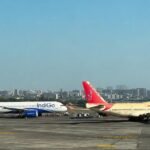 Ahmedabad, India: A potentially serious ground incident was averted at Ahmedabad's Sardar Vallabhbhai Patel International Airport after an Air India aircraft inadvertently entered an active taxiway following landing and came face-to-face with an IndiGo aircraft preparing for departure. Swift intervention by Air Traffic Control (ATC) prevented the situation from escalating, with both aircraft stopping safely before any collision occurred. The incident took place on the evening of June 24 while Air India flight AI2493, operating from Mumbai to Ahmedabad, was taxiing to its assigned parking stand after landing. According to Air India and aviation sources, the aircraft made an unintended turn while taxiing toward its designated bay, entering an active taxiway instead of following its assigned route. At the same time, IndiGo flight 6E5160, scheduled to operate from Ahmedabad to Mumbai, was taxiing for departure toward the runway. The unexpected movement brought the two Airbus A320-family aircraft onto the same taxiway, leaving them positioned directly opposite each other. According to officials, Air Traffic Control immediately instructed both flight crews to stop. The aircraft came to a halt with an estimated separation of around 200 metres, ensuring that no contact occurred between them. Authorities confirmed there were no injuries to passengers or crew and no damage to either aircraft. Following the incident, the Air India aircraft was assisted back to its designated parking bay with ground support, after which the IndiGo aircraft resumed taxiing and departed safely for Mumbai. The IndiGo flight subsequently landed safely at Chhatrapati Shivaji Maharaj International Airport in Mumbai. In an official statement, Air India acknowledged that flight AI2493 had taken an unintended turn during taxiing after landing at Ahmedabad on June 24. "We are aware of an incident where our flight AI2493 operating from Mumbai to Ahmedabad, after landing, inadvertently took a wrong turn during taxiing. There was no compromise on the safety of passengers or crew. The aircraft was subsequently moved to the correct parking bay with ground assistance," the airline said. Air India added that the matter had been reported to the Directorate General of Civil Aviation (DGCA), and an internal investigation had been initiated. IndiGo confirmed that its flight 6E5160 was taxiing for departure to Mumbai when another aircraft entered its taxi path. The airline said both aircraft were stopped immediately as a precaution in coordination with ATC. After the situation was resolved, the flight continued its departure and completed the journey safely. The Directorate General of Civil Aviation has been informed of the incident and has initiated an investigation to determine the circumstances that led to the taxiway deviation. Investigators are expected to examine the sequence of taxi instructions issued by ATC, cockpit communications, pilot adherence to taxi clearances, airport ground movement procedures and other operational factors that may have contributed to the incident. Authorities have not yet determined the cause of the wrong turn, and no findings have been released regarding whether the deviation resulted from pilot error, misunderstanding of taxi instructions, airport signage, or any other contributing factor.