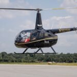 Georgia, United States: A newlywed groom and a helicopter pilot were killed when a helicopter carrying three people crashed in a remote wooded area of North Georgia shortly after departing a wedding venue late Friday night, while the bride survived with injuries, according to family members, company officials and authorities. The couple were Indian-origin Malayalis from families with roots in Kerala. The crash occurred at approximately 10:30 p.m. on May 29 near Mt. Vernon Drive in Dawson County, southwest of Dawsonville. The Federal Aviation Administration (FAA) confirmed that the aircraft involved was a Robinson R66 helicopter carrying three occupants. Family members identified one of the victims as 25-year-old groom Dave Fiji, who had celebrated his wedding only hours before the accident. The surviving passenger has been identified by relatives and local reports as his bride, Jesni Sam. The identity of the pilot has not yet been officially released by authorities. According to investigators, the helicopter had departed from a North Georgia wedding venue and was returning from a late-night flight when it went down in heavily wooded terrain. The aircraft was owned and operated by Prestige Helicopters, an Atlanta-area helicopter company. Emergency crews from the Dawson County Sheriff’s Office, Fire and EMS responded after receiving reports of a possible downed aircraft. The rugged location of the wreckage significantly complicated rescue efforts. Residents near the crash site said first responders were forced to cut through dense forest to access the area. One local resident told television reporters that crews used off-road vehicles and chainsaws to reach the wreckage, while the survivor was not recovered for several hours due to the challenging terrain. Officials confirmed that two occupants died at the scene while the female survivor was transported to a hospital for treatment. Authorities have not publicly disclosed details regarding the extent of her injuries. Prestige Helicopters Director of Operations Andy Whitaker confirmed that the crashed helicopter belonged to the company. Whitaker described the accident as unprecedented in the company's history, stating that Prestige Helicopters had maintained a clean safety record for approximately four decades before the fatal crash. Whitaker also said the pilot was familiar with the route and had flown it numerous times previously. While investigators have not determined the cause of the accident, weather conditions are emerging as one area of focus in the early stages of the investigation. Radar data from local weather coverage indicated rain and thunderstorms moving across portions of Dawson County between 9 p.m. and 11 p.m. Friday. Witnesses also reported fog in the area around the time of the crash. Prestige Helicopters' operating guidelines state that flights require at least six miles of visibility and a cloud ceiling above 600 feet, and the company does not operate flights during electrical storms or significant wind conditions. At this stage, neither the FAA nor the National Transportation Safety Board (NTSB) has identified weather as the cause of the accident. Investigators have emphasized that no conclusions have been reached and that the crash remains under investigation. The NTSB is expected to examine weather data, flight tracks, aircraft maintenance records, pilot qualifications, operational procedures and wreckage evidence. The helicopter will be moved to a secure facility for further examination. Federal investigators are also reviewing radar information, air traffic communications and witness accounts as they work to establish the sequence of events leading up to the crash. A preliminary NTSB report is expected within a few weeks, though a final determination of the probable cause could take months or longer.