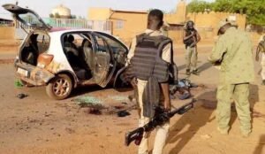 Niamey, Niger: At least 35 people were killed after heavily armed attackers launched a coordinated assault on Niger's main international airport and an adjoining military airbase in the capital Niamey on June 18, 2026, marking the second major attack on the strategic facility this year. According to Niger's Ministry of Defence, the attack left 11 members of the security forces and two civilians dead. Security forces repelled the assault, killing 22 attackers and arresting approximately 20 suspects. Weapons and ammunition were also seized during the operation. The attack targeted Diori Hamani International Airport and the adjacent military installation, a key security hub that hosts Niger's air force assets and serves as the headquarters of the joint military force formed by Niger, Mali and Burkina Faso under the Alliance of Sahel States (AES). Witnesses reported hearing sustained gunfire and explosions beginning around 6:00 a.m. local time. The fighting lasted for more than two hours as security forces battled the attackers around the airport complex. According to sources cited by Al Jazeera and AFP, some of the assailants arrived at a security checkpoint near the airport by taxi before engaging security personnel. Gunfire echoed across the area for hours as troops responded to the assault. Witnesses described scenes of panic around the airport, while soldiers later established checkpoints and conducted searches on roads leading to the facility. Four people were also wounded during the attack, according to preliminary figures released by the Defence Ministry. Despite the violence, Nigerien authorities said the airport remained secure and operational. In a statement broadcast on national television, the Defence Ministry said, "The international airport, which is fully secured, remains open to air traffic." The ministry added that a "large-scale operation" was underway to pursue those involved in the assault. Hours after the attack, Niger's National Civil Aviation Agency confirmed that airport operations had resumed normally. Responsibility for the attack was claimed by Jama'at Nusrat al-Islam wal-Muslimin (JNIM), an al-Qaeda-linked militant group that operates across the Sahel region. JNIM said it had carried out what it described as a "suicide attack" against Diori Hamani International Airport and a neighboring military base. The claim was published through the group's media outlet, Az-Zallaqa Foundation. The attack underscores the growing threat posed by jihadist groups across the Sahel, where al-Qaeda-linked and Islamic State-affiliated organizations continue to compete for territory and influence. The airport is considered one of Niger's most strategically important facilities. In addition to serving as the country's primary international gateway, the complex houses military aircraft, drones and air force infrastructure. It also serves as a command center for the Alliance of Sahel States, the regional bloc created by Niger, Mali and Burkina Faso following military takeovers in the three countries. The symbolism and military significance of the airport make it an attractive target for extremist groups seeking to challenge state authority. "The symbolism of the airport as headquarters for AES will drive intent by militants to target it," security analyst Beverly Ochieng of Control Risks told the Associated Press. The June 18 attack was the second major assault on the airport complex this year. On January 29, militants linked to Islamic State's Sahel Province launched a large-scale attack on the same facility, targeting military assets and drone infrastructure. Nigerien authorities said that the attack was repelled after fierce fighting. The latest assault reflects an evolving militant strategy in which extremist groups are increasingly expanding operations from remote rural regions into major urban centers. Ibrahim Yahaya Ibrahim, Deputy Project Director at the International Crisis Group, said the attack also reflects competition between rival jihadist factions operating in the region. "JNIM in Niger is trying to mark its territory. This is a message to the government but also to IS (Islamic State)," he said. Niger has faced escalating insecurity since the military seized power in a 2023 coup. Along with neighboring Mali and Burkina Faso, the country remains at the center of one of the world's deadliest jihadist insurgencies. The three military-led governments have shifted away from traditional Western security partnerships and strengthened cooperation with Russia while continuing operations against armed groups linked to al-Qaeda and Islamic State.