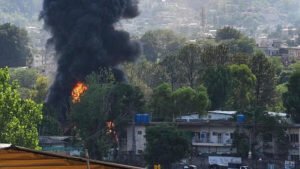 Mardan, Pakistan: A Pakistan Air Force (PAF) training aircraft crashed during a routine training mission near Mardan in Khyber Pakhtunkhwa province on Monday, killing both military personnel onboard and injuring 3 civilians on the ground, according to Pakistani military officials and local media reports. The aircraft went down in the Jabr Canal-Katlang Road area near Mardan, triggering a large fire and sending thick black smoke into the sky. Dramatic videos circulating on social media showed the aircraft descending rapidly before impacting the ground and erupting into a fireball, prompting an immediate response from rescue and emergency services. Pakistan's military confirmed that both occupants of the aircraft were killed in the crash. They were identified as Flight Lieutenant Muhammad Qasim Abdullah of the Pakistan Air Force and Lieutenant Taha Abbasi of the Pakistan Navy. The presence of a naval officer onboard indicates the sortie may have formed part of a joint training programme involving personnel from multiple branches of Pakistan's armed forces. According to the Inter-Services Public Relations (ISPR), the aircraft was conducting a routine training flight when the accident occurred. A Board of Inquiry has been ordered to determine the cause of the crash. Reports regarding civilian injuries said that 3 civilians sustained injuries from debris, while no civilian fatalities have been reported. Eyewitnesses described hearing a loud explosion before seeing flames and smoke rising from the crash site. Rescue personnel and law enforcement agencies quickly secured the area and began recovery operations. Several reports suggested the pilots may have attempted to steer the aircraft away from densely populated areas before impact, potentially reducing the scale of civilian casualties. However, this has not been officially confirmed by Pakistani authorities. President Asif Ali Zardari, Prime Minister Shehbaz Sharif and Pakistan Army Chief Field Marshal Asim Munir expressed grief over the loss of the two servicemen and extended condolences to their families. The accident occurred less than a week after another major military aviation tragedy in Pakistan, when an Army Mi-17 helicopter crashed in Pakistan-administered Kashmir, killing 22 military personnel. The back-to-back incidents have renewed attention on military aviation safety and training operations in the country. Pakistan has experienced several military training aircraft accidents over the years, though findings of official investigations are often not publicly released. Authorities have stated that the cause of the latest crash will be determined following the completion of the inquiry.