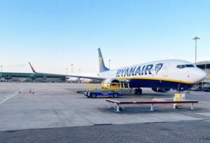 London, United Kingdom: Europe's largest low-cost carrier, Ryanair, has changed its long-standing family seating policy, allowing parents travelling with young children to sit together without paying a mandatory seat reservation fee. The move follows an investigation launched earlier this month by the UK's Competition and Markets Authority (CMA) into whether the airline's previous practice breached consumer protection laws. The revised policy took effect on Thursday, June 25, 2026, the same day Ryanair publicly announced the changes. While the airline maintains that its previous policy complied with all applicable laws and regulations, it said it would "reluctantly" adopt what it described as the industry standard rather than continue arguing with regulators. Under the updated policy, families who choose not to purchase reserved seats will receive complimentary seat allocations after completing online check-in. Ryanair said these free seats will generally be located toward the rear of the aircraft, where more seats are available. Passengers who prefer specific seats, including those closer to the front of the cabin, can still pay the usual seat reservation fee. The airline said the change would be revenue neutral, adding that it does not expect any financial impact from the revised seating arrangement. Before the change, Ryanair required at least one accompanying adult travelling with children aged 2 to 11 years to purchase what it called a "mandatory family seat." That adult paid a discounted reserved seat fee typically around £8 (US$10.70) per flight sector, according to the CMA while up to four children on the same booking could reserve adjacent seats free of charge. Ryanair argued that the policy ensured families knew their seating arrangements at the time of booking while maintaining the airline's low-fare model. The carrier also emphasized that it never charged children to sit beside their accompanying adult, only the adult reservation. The policy change came just two weeks after the Competition and Markets Authority (CMA) announced, on June 11, that it was investigating whether Ryanair's mandatory family seating fee amounted to an unfair contract term under UK consumer law. The regulator questioned whether parents were effectively being charged for the airline to meet its own obligations under aviation safety and disability rules, since Ryanair's own conditions required at least one parent to sit with children between the ages of two and eleven. The CMA also noted that additional fees could significantly increase the cost of holidays for families already budgeting carefully for travel. Ryanair Group CEO Michael O'Leary was openly critical of the regulatory pressure that led to the change. In the company's announcement, he said,"We will reluctantly adjust to this industry standard as we don't want to waste time explaining to misguided regulators how badly they misunderstand what is in the best interest of UK and Europe's consumers." O'Leary defended Ryanair's previous model, arguing it had been "the most progressive and transparent in Europe." He also accused regulators of focusing on Ryanair while overlooking broader issues affecting consumers, including higher fares charged by airlines operating without low-cost competition, airport monopoly charges, and inefficiencies in European air traffic management. According to O'Leary, the revised policy would not increase consumer welfare but merely align Ryanair with competitors' seating practices. Although the CMA welcomed the airline's decision, it stressed that the investigation has not concluded. A CMA spokesperson said the regulator would examine whether Ryanair's updated policy fully complies with consumer law. The authority added that while the revised policy appears to benefit families by removing mandatory seating charges, it does not change the fact that passengers had previously been required to pay for so-called mandatory family seats. The watchdog confirmed that Ryanair chose to amend its policy voluntarily and that the ongoing investigation will continue assessing the legality of the airline's previous practices.