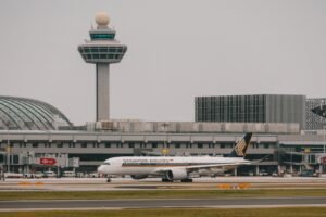 Singapore: An Indian national has been sentenced to six months in jail after molesting a Singapore Airlines flight attendant and later harassing her during a flight from Bangkok to Singapore earlier this year. The sentence was delivered by a Singapore court on June 22, 2026, bringing to a close a case that began with an in-flight incident aboard a Singapore Airlines service operating from Bangkok, Thailand, to Singapore on February 9, 2026. Akash Tiwari, 35, pleaded guilty to one charge of molestation and one charge of harassment. In addition to the jail term, the court ordered him to pay S$1,270.95 in compensation to the victim. Court records showed that he would serve an additional five days in jail if the compensation is not paid. According to court proceedings, Tiwari was travelling with four friends on the Singapore-bound flight. Prosecutors told the court that the group behaved rowdily during the journey and repeatedly waved frantically and laughed whenever female cabin crew members walked past their seats. The incident began before departure from Bangkok when a female flight attendant approached the group to confirm their meal selections. During the interaction, Tiwari stretched out his arm and brushed against the flight attendant's left upper thigh. Prosecutors said he laughed immediately afterward, while his friends also laughed at the incident. Disturbed by the behavior, the flight attendant reported the matter to the chief stewardess. To avoid further contact, she was reassigned to another aisle to continue serving passengers. However, the misconduct continued later in the flight while the flight attendant was collecting meal trays. Prosecutors said Tiwari deliberately used his left elbow to make contact with her buttock. The crew member immediately told him not to touch her. Instead of apologizing, Tiwari reportedly smirked at her. The victim became increasingly distressed and again warned him to stop. The flight attendant subsequently informed the chief stewardess, and both crew members confronted Tiwari regarding the incident. Court documents stated that he remained unapologetic and insisted he had done nothing wrong. As the aircraft began preparations for arrival in Singapore, the captain made an announcement instructing the cabin crew to prepare for landing. The flight attendant then proceeded to the galley while the chief stewardess informed her supervisor and the captain about the incident. According to prosecutors, Tiwari then followed the flight attendant into the galley area. He stood extremely close to her despite being told to stay away. When the victim attempted to create distance, he moved even closer and cornered her inside the confined space. The victim repeatedly instructed him to stop following her and to keep away. Instead, prosecutors said he persisted with the threatening behavior, causing her significant distress. The flight attendant eventually left the galley and moved into the aisle, only to discover that Tiwari was continuing to follow her. Witnesses in the cabin observed the confrontation. She sought assistance from the chief stewardess once again. By that stage, she was reportedly in tears, visibly frightened, and shaking. Following the report from the cabin crew, the flight captain notified authorities ahead of arrival. After the aircraft landed at Singapore Changi Airport, officers from the Airport Police Division conducted follow-up investigations and arrested Tiwari. Singapore Police said they were alerted to the incident at approximately 4:27 p.m. on February 9. The case first entered the court system on March 17, 2026, when Tiwari was formally charged with using criminal force to outrage the modesty of the victim and with causing harassment, alarm, or distress through threatening behavior. At the time, he indicated that he intended to contest the allegations and plead not guilty. A pre-trial conference was subsequently scheduled for March 26. Court documents alleged that Tiwari deliberately used his body to make contact with the victim's buttock area and later followed her into the galley, cornered her in the confined space, and continued pursuing her after she attempted to leave. A gag order was imposed throughout the proceedings to protect the identity of the victim. During sentencing proceedings, prosecutors highlighted Tiwari's lack of remorse, noting that he smirked when confronted and remained unapologetic despite the victim's visible distress. On June 22, 2026, the court sentenced Tiwari to six months' imprisonment and ordered compensation of S$1,270.95 to the victim, consisting of compensation for emotional trauma and related expenses. The case has drawn significant attention in Singapore because it involved misconduct against airline cabin crew while operating aboard an international commercial flight. Singapore authorities reiterated that offenders who commit acts of molestation, harassment, and threatening behavior will be dealt with firmly under the law, whether such conduct occurs on an aircraft or elsewhere.