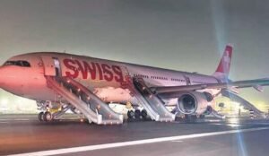 New Delhi, India: India's Aircraft Accident Investigation Bureau (AAIB) has released its preliminary findings into the serious incident involving a Swiss International Air Lines Airbus A330-343 that suffered a left-engine failure during takeoff at Delhi's Indira Gandhi International Airport, forcing the crew to reject takeoff and conduct an emergency evacuation. The incident occurred shortly after 1:27 a.m. local time on April 26, 2026, when Swiss flight LX147 was preparing to depart Delhi for Zurich with 245 people onboard, including 232 passengers and 13 crew members. According to the AAIB report, the aircraft involved was a 2012-built Airbus A330-343, registered HB-JHK, powered by Rolls-Royce Trent 772B-60 engines. The aircraft had arrived in Delhi earlier that day, operating flight LX146 from Zurich. Investigators noted that the inbound Zurich–Delhi flight was uneventful. While seven maintenance complaints were logged after arrival, all were described as routine and unrelated to the aircraft's engines, flight controls, serviceability, or controllability. The reported issues were addressed before the aircraft was cleared for the return flight to Switzerland. No abnormalities were detected during pre-flight inspections before LX147's departure from Delhi. The aircraft, parked at Stand A14, received pushback and startup clearance before taxiing to Runway 28 via taxiway J6. At 01:25:56 IST, air traffic control cleared the flight for takeoff with light winds reported from 210 degrees at one knot. Moments later, during the takeoff roll, the aircraft accelerated to approximately 106 knots. According to cockpit reports cited by investigators, the crew heard a loud bang as the No. 1 engine experienced a failure. Pilots reported seeing a large flame projecting forward from the left engine and observed the aircraft veering left. The crew immediately rejected the takeoff and brought the aircraft to a stop on Runway 28 between taxiways G1 and G2. After stopping, the flight crew informed air traffic controllers of the engine failure and requested emergency services. Communications recorded by investigators show that airport vehicles and crash fire tenders responded rapidly. Initially, responders observed smoke around the aircraft. As emergency personnel continued assessing the situation, reports indicated smoke near the left landing gear and subsequently fire near the right landing gear area. Fire crews began firefighting operations while coordinating with air traffic controllers and the flight crew. At approximately 01:35 IST, a full airport emergency was declared. Following confirmation of smoke and fire indications, both engines were shut down. Emergency evacuation procedures were initiated directly on the runway. Seven of the aircraft's eight evacuation slides were deployed and used to evacuate passengers and crew. All occupants successfully exited the aircraft. Four passengers sustained injuries during the evacuation and were transported for medical treatment. Airport responders reported that the fire had been completely extinguished by approximately 01:50 IST. The aircraft was later towed from the runway and parked at a remote stand. The airport terminated the full emergency status at 04:50 IST. Data obtained from the aircraft's post-flight report showed the first recorded warning was an "ENG 1 Stall" message at 01:27 IST during the takeoff roll. This was followed by multiple system messages including "ENG 1 FAIL," "AIR PACK 1+2 FAULT," "F/CTL RUD TRIM 1 FAULT," and "ENG 1 REV UNLOCKED." An "ENG 1 SHUTDOWN" message was subsequently recorded after the aircraft came to a stop. Investigators conducted an external inspection of the aircraft and found metallic debris near the exhaust section of the left engine along with soot and burn marks on the engine pylon behind the exhaust area. Notably, no damage was observed on the engine fan blades, and investigators reported no significant structural damage to the aircraft apart from minor dents likely caused during emergency slide deployment. A borescope inspection of the failed engine revealed extensive internal damage. Investigators discovered broken bolts and spacers from the high-pressure/intermediate-pressure bearing support assembly within the thrust reverser ducts. High-pressure bleed valves were also partially blocked by debris. Further examination identified significant damage to components within the engine core, including the High Pressure Turbine, Intermediate Pressure Turbine, Low Pressure Turbine, and High Pressure Compressor sections. Both the high-pressure and intermediate-pressure shafts were seized, preventing complete inspection. The AAIB stated that although severe internal engine damage was identified, investigators were unable to determine the precise cause of the engine failure during the initial borescope examination because the engine's rotating assemblies could not be fully inspected. Importantly, investigators found no evidence of an uncontained engine failure. The failed Rolls-Royce Trent 772B-60 engine was manufactured in 2009 and had accumulated more than 75,500 operating hours and 11,369 flight cycles. Records show the engine's last overhaul occurred in May 2016. Since that overhaul, it had accumulated nearly 40,000 additional flight hours before the incident. Both cockpit crew members were appropriately licensed and qualified on the Airbus A330. The captain had more than 18,600 total flight hours, while the first officer had accumulated more than 2,170 hours. AAIB investigators have removed and downloaded data from both the cockpit voice recorder and flight data recorder. Analysis of the recorded information is ongoing. The bureau said the damaged engine will be removed from the aircraft for a detailed examination aimed at identifying the root cause of the failure. Investigators are also reviewing maintenance records, operational documentation, air traffic control recordings, and witness statements. The investigation includes participation from international authorities and technical experts. France's Bureau d'Enquêtes et d'Analyses (BEA), Airbus, the European Union Aviation Safety Agency (EASA), Germany's BFU, the United Kingdom's AAIB, and Rolls-Royce representatives are assisting the Indian investigation under the provisions of ICAO Annex 13. The AAIB emphasized that the findings released so far are preliminary and subject to change as the investigation progresses. No interim safety recommendations have been issued at this stage.