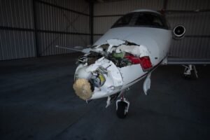 North Carolina, United States: A corporate business jet collided with a box truck while taxiing at Raleigh-Durham International Airport (RDU) in North Carolina on Wednesday afternoon, temporarily shutting down the airport's airfield, disrupting flight operations and prompting an investigation by federal authorities. The incident occurred on Taxiway C at approximately 2 p.m. local time on July 1, according to airport officials. The aircraft involved has been identified as a Nicholas Air Embraer EMB-500 Phenom 100 business jet, registered as N356N and operating as JTZ356, aviation records show. Airport officials confirmed that two occupants aboard the aircraft and the lone driver of the box truck escaped without injuries. Images from the scene showed the aircraft sustaining significant damage to its nose section, while emergency responders quickly secured the area following the collision. The damaged aircraft was later moved into a hangar as investigators began examining the incident. The accident forced RDU to close its airfield for nearly an hour, halting arriving and departing traffic before operations resumed at around 2:30 p.m. Airport spokesperson Stephanie Hawco confirmed that the airfield was reopened after emergency crews cleared the taxiway and determined it was safe to resume operations. Although the closure was brief, it caused widespread disruption across the airport's flight schedule. According to airport officials and flight tracking data, between 15 and 20 flights were diverted or delayed. Several inbound aircraft were rerouted to Charlotte Douglas International Airport, while others diverted to Greensboro and Washington Dulles International Airport. A Copa Airlines service originally bound for Raleigh was among the flights diverted to Dulles. Charlotte Douglas Airport later confirmed that six diverted aircraft were expected to refuel before returning to RDU. The disruption also affected departing passengers. A scheduled international flight to Germany departed approximately three hours late, while travelers reported extended waits as the temporary closure created a ripple effect across the airport's operations. One passenger told WRAL that he considered driving to Greensboro after his daughter's incoming flight was diverted but was later informed that the aircraft would eventually return to Raleigh. During the same period, airport officials also handled an unrelated event involving an incoming aircraft that reported a possible mechanical issue. The aircraft landed safely and was not connected to the taxiway collision. Flight instructor Steve Welsh told WRAL that aircraft generally have the right of way on taxiways and noted that business jets possess significant blind spots, making strict coordination between aircraft and ground vehicles essential. "In incidents where a vehicle hits an aircraft, the aircraft always has the right of way," Welsh said, adding that vehicles approaching from the side may not become visible to pilots until they are very close to the aircraft. RDU later issued a statement confirming normal operations had resumed. "RDU closed the airfield briefly earlier this afternoon after a general aviation aircraft and a box truck collided on a taxiway. There were no injuries, and the airfield has reopened to arriving and departing flights." Videos shared by witnesses on social media showed emergency vehicles surrounding the damaged aircraft while airport operations remained suspended during the response. According to airport statistics, Raleigh-Durham International Airport handles approximately 360 daily arrivals and departures served by 17 airlines. The airport recorded 5.6 million passengers in 2025, marking its busiest year on record. The National Transportation Safety Board (NTSB) has launched an investigation into the collision. Authorities have not yet determined the cause, and it remains unclear whether the incident resulted from pilot actions, vehicle operations, airport procedures or another contributing factor.