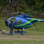 Two Killed, One Injured In Hughes 500 Forestry Helicopter Crash In British Columbia SEO DES: A West Coast Helicopters Hughes 500 on a CFMG forestry mission crashed, killing the pilot and one worker, while the third occupant was seriously injured SOCIAL: A West Coast Helicopters Hughes 500 crashed during a CFMG forestry operation near Loughborough Inlet on British Columbia's Central Coast at around 6:15 a.m. on July 14, killing pilot Riley Browne and forestry worker Bobby Nowak, while a third occupant was seriously injured. The survivor was airlifted to hospital, and the Transportation Safety Board of Canada (TSB) has launched an investigation. The cause of the crash remains unknown, with authorities yet to release details on the helicopter's registration, weather conditions, or any possible mechanical issues. Image: West Coast Helicopters (Representational) Video: West Coast Helicopters (Representational) Loughborough Inlet, Canada: Two people were killed and another was seriously injured after a Hughes 500 helicopter operating on a forestry mission crashed in British Columbia's remote Central Coast on the morning of July 14, prompting a Transportation Safety Board of Canada (TSB) investigation into the fatal accident. The helicopter, operated by West Coast Helicopters, went down at approximately 6:15 a.m. local time in Loughborough Inlet, near Knight Inlet, a rugged coastal area located about 80 kilometres north of Campbell River on Vancouver Island. The aircraft was conducting forestry operations in support of CFMG, a forestry company working in the area. According to West Coast Helicopters, three people were on board the aircraft: the pilot and two forestry personnel. The crash claimed the lives of the pilot and one member of the CFMG crew, while the third occupant survived and was rescued with serious injuries. The company has not disclosed what led to the helicopter coming down, and investigators have yet to determine the cause of the accident. British Columbia Emergency Health Services said the surviving occupant was airlifted from the remote crash site by air ambulance. The injured survivor was first transported to Canadian Forces Base Comox before being transferred to hospital, where officials said the person remained in serious but stable condition. West Coast Helicopters later identified its deceased pilot as Riley Browne, who had been flying with the company since 2021. In a statement shared on social media, the operator paid tribute to Browne, describing him as one of the company's most valued pilots. "He always had a smile on his face, eager to help. Riley started his flying career at WCH in 2021. He was one of the pillars of the company. We all loved him,” West Coast Helicopters said. The company also extended condolences to Browne's family, noting they are a well-known and close-knit family in the Port McNeill community. "Our thoughts, condolences and prayers go out to Riley's family... Rest in peace, Riley. You will not be forgotten,” the company added. Several media outlets and the helicopter operator reported that the second person killed was Bobby Nowak, a member of the CFMG forestry crew. However, as of the latest official updates, CFMG has not publicly confirmed the identity of its employee or released a statement regarding the fatality. The helicopter involved was identified by the operator as a Hughes 500, a light utility helicopter widely used in forestry, aerial survey, utility and remote-access operations because of its maneuverability and ability to operate in challenging terrain. Authorities have not yet released the aircraft's registration, serial number or year of manufacture. Likewise, officials have not disclosed whether the helicopter suffered a mechanical failure, encountered adverse weather or experienced any other operational issues before the crash. No eyewitness accounts describing the accident have been released publicly. Given the isolated nature of Loughborough Inlet, authorities have not indicated whether anyone on the ground observed the helicopter before it crashed. Investigators have also not disclosed whether distress calls were transmitted or whether flight tracking data captured the aircraft's final moments. The Transportation Safety Board of Canada has deployed a team of investigators to the crash site. According to the agency, investigators arrived at the location to document the wreckage, gather evidence and assess the occurrence before determining the scope of the investigation. The TSB has not released any preliminary findings, and no probable cause has been identified. Investigators are expected to examine the helicopter's maintenance records, operational history, weather conditions, pilot qualifications and any available technical evidence as part of the investigation. As with other TSB investigations, a final report could take several months before the agency determines the factors that led to the crash.