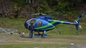 Two Killed, One Injured In Hughes 500 Forestry Helicopter Crash In British Columbia SEO DES: A West Coast Helicopters Hughes 500 on a CFMG forestry mission crashed, killing the pilot and one worker, while the third occupant was seriously injured SOCIAL: A West Coast Helicopters Hughes 500 crashed during a CFMG forestry operation near Loughborough Inlet on British Columbia's Central Coast at around 6:15 a.m. on July 14, killing pilot Riley Browne and forestry worker Bobby Nowak, while a third occupant was seriously injured. The survivor was airlifted to hospital, and the Transportation Safety Board of Canada (TSB) has launched an investigation. The cause of the crash remains unknown, with authorities yet to release details on the helicopter's registration, weather conditions, or any possible mechanical issues. Image: West Coast Helicopters (Representational) Video: West Coast Helicopters (Representational) Loughborough Inlet, Canada: Two people were killed and another was seriously injured after a Hughes 500 helicopter operating on a forestry mission crashed in British Columbia's remote Central Coast on the morning of July 14, prompting a Transportation Safety Board of Canada (TSB) investigation into the fatal accident. The helicopter, operated by West Coast Helicopters, went down at approximately 6:15 a.m. local time in Loughborough Inlet, near Knight Inlet, a rugged coastal area located about 80 kilometres north of Campbell River on Vancouver Island. The aircraft was conducting forestry operations in support of CFMG, a forestry company working in the area. According to West Coast Helicopters, three people were on board the aircraft: the pilot and two forestry personnel. The crash claimed the lives of the pilot and one member of the CFMG crew, while the third occupant survived and was rescued with serious injuries. The company has not disclosed what led to the helicopter coming down, and investigators have yet to determine the cause of the accident. British Columbia Emergency Health Services said the surviving occupant was airlifted from the remote crash site by air ambulance. The injured survivor was first transported to Canadian Forces Base Comox before being transferred to hospital, where officials said the person remained in serious but stable condition. West Coast Helicopters later identified its deceased pilot as Riley Browne, who had been flying with the company since 2021. In a statement shared on social media, the operator paid tribute to Browne, describing him as one of the company's most valued pilots. "He always had a smile on his face, eager to help. Riley started his flying career at WCH in 2021. He was one of the pillars of the company. We all loved him,” West Coast Helicopters said. The company also extended condolences to Browne's family, noting they are a well-known and close-knit family in the Port McNeill community. "Our thoughts, condolences and prayers go out to Riley's family... Rest in peace, Riley. You will not be forgotten,” the company added. Several media outlets and the helicopter operator reported that the second person killed was Bobby Nowak, a member of the CFMG forestry crew. However, as of the latest official updates, CFMG has not publicly confirmed the identity of its employee or released a statement regarding the fatality. The helicopter involved was identified by the operator as a Hughes 500, a light utility helicopter widely used in forestry, aerial survey, utility and remote-access operations because of its maneuverability and ability to operate in challenging terrain. Authorities have not yet released the aircraft's registration, serial number or year of manufacture. Likewise, officials have not disclosed whether the helicopter suffered a mechanical failure, encountered adverse weather or experienced any other operational issues before the crash. No eyewitness accounts describing the accident have been released publicly. Given the isolated nature of Loughborough Inlet, authorities have not indicated whether anyone on the ground observed the helicopter before it crashed. Investigators have also not disclosed whether distress calls were transmitted or whether flight tracking data captured the aircraft's final moments. The Transportation Safety Board of Canada has deployed a team of investigators to the crash site. According to the agency, investigators arrived at the location to document the wreckage, gather evidence and assess the occurrence before determining the scope of the investigation. The TSB has not released any preliminary findings, and no probable cause has been identified. Investigators are expected to examine the helicopter's maintenance records, operational history, weather conditions, pilot qualifications and any available technical evidence as part of the investigation. As with other TSB investigations, a final report could take several months before the agency determines the factors that led to the crash.