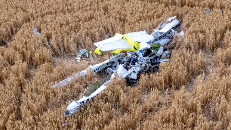 Ongar, United Kingdom: Two people were killed after a light aircraft crashed into a field near High Ongar in Essex shortly after departing North Weald Airfield on what authorities described as a "short flight experience," prompting a multi-agency emergency response and a formal investigation by the UK's Air Accidents Investigation Branch (AAIB). The aircraft, a Cessna 152, came down in farmland off Mill Lane, High Ongar, at approximately 12:30 p.m. BST on Tuesday, June 30. Emergency services were called to the scene shortly after the crash, but both occupants were pronounced dead. Essex Police confirmed that the victims died at the scene. As of the latest official update, authorities have not publicly identified either individual, stating that formal identification procedures and notifications to their next of kin remain ongoing. According to Essex Police, the aircraft had departed from North Weald Airfield shortly before the accident for what was described as a short flight experience. Flight-tracking data from Flightradar24, cited by several British media outlets, shows the aircraft departed at approximately 12:22 p.m. The aircraft initially flew east before making a turn back toward North Weald. Roughly eight minutes after take-off, the aircraft disappeared from radar at around 12:30 p.m., coinciding with the reported crash time. The flight path indicates the aircraft remained relatively close to the departure airfield throughout the flight. Flightradar24 data further indicated that the same aircraft had completed two flights earlier on the day of the accident and had flown five separate flights the previous day, suggesting it had been conducting multiple local experience or training flights. Authorities have not stated whether the accident occurred while the aircraft was attempting to return to North Weald or whether the return track reflected the planned flight profile. The aircraft came down in an agricultural field near Mill Lane in High Ongar, a rural village northeast of North Weald. Images from the crash site showed extensive damage to the aircraft, which came to rest in the field following impact. Emergency services secured the area while investigators began documenting the wreckage. Police established cordons around the crash site, restricting access as specialist investigators examined the wreckage. Authorities have not disclosed whether a fire followed the impact, nor have they released any preliminary findings regarding the aircraft's attitude, speed or configuration before the crash. Essex Police coordinated the emergency response alongside: Essex County Fire and Rescue Service East of England Ambulance Service Air ambulance resources Air Accidents Investigation Branch (AAIB) Emergency crews arrived shortly after receiving reports of the crash. Despite their efforts, both occupants were confirmed deceased at the scene. The police subsequently appealed for witnesses and requested that anyone who may have seen the aircraft before the accident or captured photographs, video footage or dashcam recordings contact investigators. The Air Accidents Investigation Branch (AAIB) launched a formal investigation immediately after the accident. The agency confirmed that it dispatched a multidisciplinary team consisting of specialists in: Aircraft operations Engineering Human factors Recorded data and evidence collection Investigators began examining the wreckage, documenting the accident site and collecting physical evidence. The AAIB has not released any preliminary findings, and investigators have emphasized that it is too early to determine the cause of the accident. No indication has been given that mechanical failure, pilot actions, weather or any other factor contributed to the crash. Those questions remain under investigation. A preliminary AAIB report is expected in due course, while a comprehensive final report may take many months to complete. Authorities have confirmed only that two people were on board the aircraft. Although police described the flight as a "short flight experience," they have not officially confirmed the identities or roles of the occupants, including whether one was an instructor and the other a passenger or trial-flight participant. Their names, ages and hometowns have not yet been released publicly. Police stated that specialist officers are supporting the families while formal identification procedures continue.