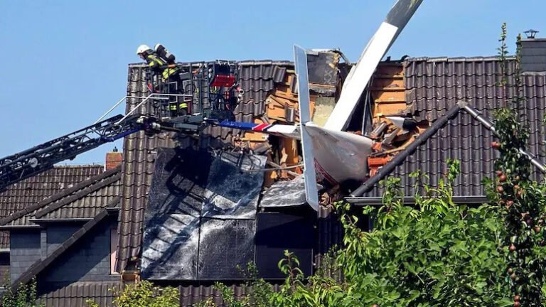 Ganderkesee, Germany: Two men were killed after a small private aircraft crashed into the roof of a residential house in Ganderkesee, in Germany’s Lower Saxony state, on Saturday, July 25, 2026, police said. The aircraft crashed at around 11 a.m. local time in a residential area near Oldenburg after apparently losing altitude for reasons that remain unknown. It struck the pitched roof of a single-family home head-on, becoming embedded in the structure. The aircraft was reportedly a single-engine, four-seat light aircraft manufactured by Italian company Tecnam and had taken off from Bremen shortly before the accident. The two people aboard the aircraft were men aged 65 and 77, both from Bremen, according to police. Initially, authorities confirmed that one occupant had died and said a second person was missing following the crash. Emergency crews spent several hours searching for the missing occupant, with the recovery operation complicated by the aircraft being lodged in the roof and concerns that the damaged house could be structurally unstable. The second occupant was eventually found dead, bringing the confirmed death toll to two. According to the Delmenhorst police department, the deaths of both occupants were established following lengthy and complex recovery operations involving the aircraft wreckage. The initial response was complicated by the position of the aircraft and the condition of the building. Emergency personnel could not safely enter the house from below because of the potential risk of collapse. Firefighters used a ladder platform to inspect the structure, but the second occupant could not initially be located. The aircraft wreckage was subsequently removed from the roof as part of the recovery operation. The residents of the house were not at home when the aircraft crashed, and no other injuries were reported. Authorities nevertheless evacuated residents living within approximately 100 metres of the crash site as a precaution. Electricity along the affected road was also temporarily switched off for safety reasons, while the area was cordoned off and emergency services carried out recovery and investigation work. A large emergency response was deployed, involving police, firefighters, rescue services, the Technical Relief Agency (THW) and other emergency personnel. A crisis intervention team was also made available to support witnesses and residents affected by the incident. The airspace around the crash site was temporarily restricted while emergency crews operated drones and worked to secure the scene. The aircraft was eventually recovered from the damaged roof, allowing evacuated residents to return to their homes. The wreckage has been secured for further examination. The cause of the crash remains unknown. German authorities have launched an investigation into the circumstances surrounding the accident, while the Federal Bureau of Aircraft Accident Investigation (BFU) is expected to examine the wreckage as part of the ongoing investigation. Authorities are also working to establish which of the two men was piloting the aircraft at the time of the crash.