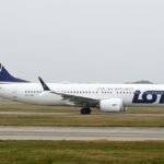 Milan, Italy: A LOT Polish Airlines Boeing 737-8 MAX operating from Palma de Mallorca, Spain, to Warsaw, Poland, was diverted to Milan Malpensa early Thursday, July 23, after a pilot reportedly became incapacitated in flight. The aircraft was operating LOT flight LO6212 from Palma de Mallorca to Warsaw. The aircraft, registered SP-LVO, was cruising at approximately Flight Level 360 when the flight crew decided to divert to Milan after the captain reportedly became incapacitated. The aircraft subsequently landed safely on Runway 35R at Milan Malpensa, with the diversion understood to have taken place shortly after 4 a.m. local time. The emergency response was activated at around 4:05 a.m., after the commander suffered a medical problem. The Boeing 737 MAX 8 landed at Malpensa at approximately 4:30 a.m., with ambulances, medical vehicles and firefighters dispatched to meet the aircraft. Reports said one of the pilots had reportedly fainted or lost consciousness in the cockpit shortly after takeoff. The aircraft had been in the air for less than an hour when it diverted to Milan and emergency responders included five paramedics, three ambulances and two medical vehicles. The affected pilot was reportedly assessed by medical personnel and did not require major medical treatment. No passenger injuries were reported. LOT Polish Airlines spokesperson Krzysztof Moczulski confirmed that the aircraft was diverted to Milan for medical reasons, the captain requested medical assistance because of the illness of a crew member. The airline did not publicly disclose the exact medical condition or identify precisely which crew member had fallen ill. Following the diversion, the aircraft remained at Milan Malpensa for several hours. A new crew was sent to Milan, after which passengers continued their journey to Warsaw on the same Boeing 737 MAX 8. The flight reportedly departed Malpensa shortly after 11 a.m., with passengers continuing onward after the unexpected stop. The aircraft eventually continued to Warsaw after spending approximately seven hours on the ground, arriving with a delay of around six and a half hours. The incident triggered an immediate emergency response at Milan Malpensa, but the aircraft landed safely and there were no reported injuries among passengers. The precise nature of the crew member's medical problem has not been disclosed publicly, and no further details about the affected crew member's condition were provided in the available reports.