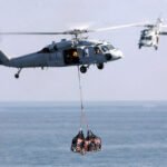 US Navy Helicopter Makes Emergency Landing In Arabian Sea; One Crew Member Missing SEO DES: Four crew were aboard the US Navy MH-60S Sea Hawk when it made an emergency water landing during routine operations; three were rescued & one remains missing SOCIAL: A US Navy MH-60S Sea Hawk helicopter assigned to USS George H.W. Bush made an emergency water landing in the Arabian Sea during routine operations on July 1, leaving one crew member missing while three others were rescued and are in stable condition. The incident occurred at approximately 3:30 a.m. ET, prompting an extensive search-and-rescue operation involving US Navy ships and aircraft deployed in the region. Officials said there is no indication the emergency was caused by hostile action, and the cause of the water landing remains under investigation. The helicopter was operating from the USS George H.W. Bush Carrier Strike Group, which is deployed to the Middle East in support of maritime security and regional operations under US Central Command (CENTCOM). Search efforts for the missing crew member are ongoing. Image: Marvin Harris (Wikimedia) Video: US Navy United States: A United States Navy MH-60S Sea Hawk helicopter assigned to the aircraft carrier USS George H.W. Bush (CVN-77) made an emergency water landing in the Arabian Sea early on July 1, leaving one crew member missing while three others were rescued safely, according to the US Naval Forces Central Command (NAVCENT) and US 5th Fleet. The Navy said the helicopter conducted the emergency water landing at approximately 3:30 a.m. Eastern Time (ET) during routine operations in the Arabian Sea. Authorities have not disclosed the exact location of the incident or what prompted the crew to ditch the aircraft into the water, stating only that the cause remains under investigation. The aircraft was carrying four crew members at the time of the incident. Three were recovered shortly after the emergency landing and were reported to be in stable condition aboard USS George H.W. Bush, while an extensive search-and-rescue operation remains underway to locate the fourth crew member. US Navy ships and aircraft deployed in the region continue to support the ongoing search. In its official statement, NAVCENT emphasized that there is no indication the emergency was caused by hostile action, effectively ruling out any immediate evidence of enemy fire or an attack. Investigators have not identified mechanical failure, weather or any other contributing factor, and officials have yet to release the identities of the crew members pending family notification. The helicopter involved was an MH-60S Sea Hawk, a multi-mission naval helicopter used primarily for combat support, logistics, search and rescue, medical evacuation, maritime security, humanitarian assistance and disaster relief missions. The variant typically operates with a crew of three to four personnel and is equipped with large sliding cabin doors to facilitate rescue and transport operations. The MH-60S was operating from USS George H.W. Bush, a Nimitz-class nuclear-powered aircraft carrier deployed to the U.S. Central Command (CENTCOM) area of responsibility. The carrier departed Naval Station Norfolk, Virginia, on March 31, 2026, transited around the Cape of Good Hope, and has been operating in the Arabian Sea since April 23 as part of the U.S. military's expanded presence in the Middle East. USS George H.W. Bush is embarked with Carrier Air Wing 7, which includes Helicopter Sea Combat Squadron (HSC) 5 "Nightdippers", the squadron that operates the MH-60S Sea Hawk. While the Navy has not officially identified the helicopter's unit, HSC-5 is the squadron assigned to fly the MH-60S from the carrier. The incident occurred amid heightened U.S. military activity across the Middle East. George H.W. Bush Carrier Strike Group is one of the principal naval forces operating under U.S. Central Command, supporting maritime security operations and safeguarding key shipping lanes across the Arabian Sea, Gulf of Oman, Red Sea and Arabian Gulf. According to military reports, approximately 50,000 U.S. service members are currently deployed across the CENTCOM area, with a significant proportion of the Navy's deployed battle force ships operating in the region. Officials have not confirmed whether the helicopter has been recovered or remains in the sea. Likewise, they have not indicated whether the aircraft was conducting a training mission, operational sortie or logistics flight when the emergency occurred. The Navy said search efforts for the missing crew member will continue while investigators work to determine what caused the helicopter to ditch.