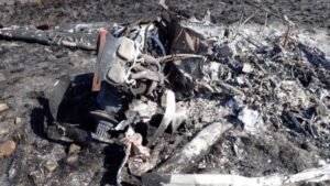 SACAA Preliminary Report Details Cessna 172 Cockpit Fire And Student Pilot's Escape SEO DES: An Aviation Junction Flying School student pilot was seriously injured after a Cessna 172M caught fire during a go-around near Secunda on May 27, 2026 SOCIAL: The South African Civil Aviation Authority (SACAA) has released its preliminary report into the 27 May 2026 crash of a Cessna 172M (ZS-JBO) near Secunda, Mpumalanga, involving a solo student pilot of Aviation Junction Flying School. During a go-around after encountering windshear, the aircraft's flaps failed to retract, the airspeed decayed, the stall warning activated, and a cockpit fire broke out. The pilot conducted a forced landing, burned through a jammed seatbelt using the cockpit fire, and jumped from the aircraft moments before impact, surviving with serious burn and facial injuries. The aircraft was destroyed by fire. Investigators found the aircraft was airworthy before the flight, but the fire severely damaged the wreckage, preventing determination of the exact impact sequence. The AIID said the investigation remains ongoing, and no safety recommendations have been issued at this stage. Secunda, South Africa: The South African Civil Aviation Authority (SACAA) has released its preliminary accident report into the crash of a Cessna 172M (registration ZS-JBO) that occurred on 27 May 2026 near Graceland Golf Course, Secunda, Mpumalanga Province, South Africa. The accident involved one person on board, a 20-year-old Saudi Arabian student pilot conducting a solo training flight. The student survived with serious injuries, while the aircraft was destroyed by an in-flight fire following an attempted go-around. The aircraft, operated by Aviation Junction Flying School under Part 141 training operations, departed Secunda Aerodrome (FASC) at approximately 0930 UTC for a solo training sortie in the general flying area. The flight was conducted during daylight under visual meteorological conditions (VMC). Before departure, the student pilot completed the required pre-flight inspections and refuelled the aircraft with 60 litres of Avgas. No defects had been recorded in the aircraft's flight folio before the flight. According to the preliminary investigation, the accident sequence began when the student returned to Runway 29 at Secunda. During the final approach, with the wing flaps selected to 30 degrees, the aircraft encountered windshear, prompting the pilot to initiate a go-around. During the manoeuvre, the pilot attempted to retract the flaps, but they failed to retract. The aircraft's indicated airspeed then decreased, activating the stall warning. Although the student managed to recover from the developing stall, he soon noticed smoke inside the cockpit, followed almost immediately by fire. Realising the aircraft could no longer continue safely, the student pilot selected a field near Graceland Golf Course for a forced landing. While flying over the golf course perimeter fence, he attempted to unbuckle his seatbelt but found it jammed. In the report investigators state that the pilot used the cockpit fire to burn through the seatbelt material, allowing him to free himself. He then opened the aircraft's left-side door and jumped from the aircraft approximately six to eight feet above the ground, moments before it crashed. The pilot sustained serious facial injuries from the jump and burn injuries to both arms and his right leg. Golf course workers who witnessed the accident reported hearing the aircraft approach followed seconds later by a loud bang. They observed grey-to-black smoke rising from the wreckage and found the aircraft engulfed in flames upon reaching the site. The workers rescued the injured pilot by moving him away from the advancing grass fire before emergency services arrived. He was initially treated at a hospital in Secunda before being transferred to a specialist hospital in Gauteng for facial surgery. The accident occurred at approximately 1030 UTC, around 2.33 kilometres from Secunda Aerodrome, at an elevation of 5,195 feet. There were no fatalities, no passengers, and no injuries to people on the ground. The aircraft was destroyed by the post-impact fire. Investigators noted that the aircraft's nose landing gear and left main landing gear had separated from the fuselage, while both propeller blades were found bent backwards. However, because the fire destroyed much of the aircraft, investigators stated it is not yet possible to determine precisely how the aircraft impacted the ground. The cockpit and cabin were almost completely consumed by fire, making identification of several components difficult. The pilot held a valid Student Pilot Licence (SPL) and had accumulated 74.2 total flying hours, including only 4.1 hours on the Cessna 172M, having transitioned from a Tecnam Echo earlier in 2026. His Class 2 aviation medical certificate was valid until November 2028 with no restrictions. The aircraft, a 1975-built Cessna 172M, had accumulated 22,791.5 airframe hours. It held a valid Certificate of Airworthiness and Certificate of Release to Service, with its latest maintenance inspection completed only weeks before the accident. The report also notes the aircraft had previously been involved in four earlier occurrences between 2003 and 2022, including a forced landing following engine power loss, a wind-related ground damage event, a hard landing, and a nose-wheel collapse after a bounced landing. Weather conditions recorded at nearby Ermelo Aerodrome around the time of the accident indicated 210-degree winds at 5 knots, 10 kilometres visibility, 20°C temperature, no cloud, and a QNH of 1028 hPa. The report stresses that these findings do not assign blame or liability, and that the investigation remains ongoing. At this stage, no safety recommendations have been issued.