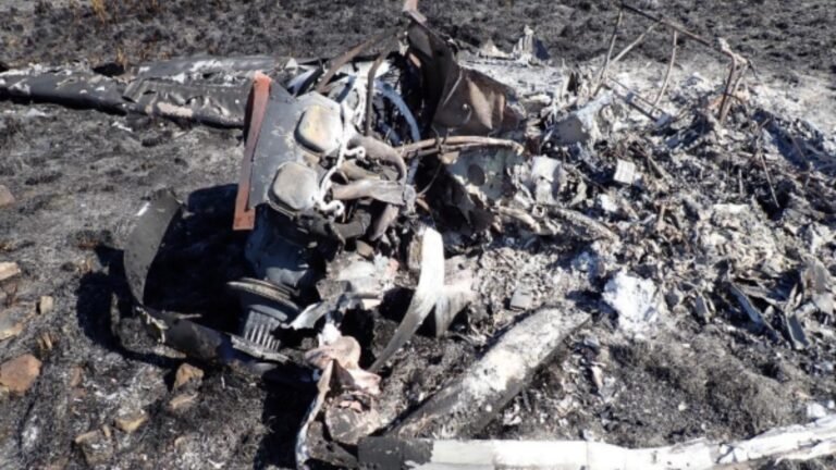 SACAA Preliminary Report Details Cessna 172 Cockpit Fire And Student Pilot's Escape SEO DES: An Aviation Junction Flying School student pilot was seriously injured after a Cessna 172M caught fire during a go-around near Secunda on May 27, 2026 SOCIAL: The South African Civil Aviation Authority (SACAA) has released its preliminary report into the 27 May 2026 crash of a Cessna 172M (ZS-JBO) near Secunda, Mpumalanga, involving a solo student pilot of Aviation Junction Flying School. During a go-around after encountering windshear, the aircraft's flaps failed to retract, the airspeed decayed, the stall warning activated, and a cockpit fire broke out. The pilot conducted a forced landing, burned through a jammed seatbelt using the cockpit fire, and jumped from the aircraft moments before impact, surviving with serious burn and facial injuries. The aircraft was destroyed by fire. Investigators found the aircraft was airworthy before the flight, but the fire severely damaged the wreckage, preventing determination of the exact impact sequence. The AIID said the investigation remains ongoing, and no safety recommendations have been issued at this stage. Secunda, South Africa: The South African Civil Aviation Authority (SACAA) has released its preliminary accident report into the crash of a Cessna 172M (registration ZS-JBO) that occurred on 27 May 2026 near Graceland Golf Course, Secunda, Mpumalanga Province, South Africa. The accident involved one person on board, a 20-year-old Saudi Arabian student pilot conducting a solo training flight. The student survived with serious injuries, while the aircraft was destroyed by an in-flight fire following an attempted go-around. The aircraft, operated by Aviation Junction Flying School under Part 141 training operations, departed Secunda Aerodrome (FASC) at approximately 0930 UTC for a solo training sortie in the general flying area. The flight was conducted during daylight under visual meteorological conditions (VMC). Before departure, the student pilot completed the required pre-flight inspections and refuelled the aircraft with 60 litres of Avgas. No defects had been recorded in the aircraft's flight folio before the flight. According to the preliminary investigation, the accident sequence began when the student returned to Runway 29 at Secunda. During the final approach, with the wing flaps selected to 30 degrees, the aircraft encountered windshear, prompting the pilot to initiate a go-around. During the manoeuvre, the pilot attempted to retract the flaps, but they failed to retract. The aircraft's indicated airspeed then decreased, activating the stall warning. Although the student managed to recover from the developing stall, he soon noticed smoke inside the cockpit, followed almost immediately by fire. Realising the aircraft could no longer continue safely, the student pilot selected a field near Graceland Golf Course for a forced landing. While flying over the golf course perimeter fence, he attempted to unbuckle his seatbelt but found it jammed. In the report investigators state that the pilot used the cockpit fire to burn through the seatbelt material, allowing him to free himself. He then opened the aircraft's left-side door and jumped from the aircraft approximately six to eight feet above the ground, moments before it crashed. The pilot sustained serious facial injuries from the jump and burn injuries to both arms and his right leg. Golf course workers who witnessed the accident reported hearing the aircraft approach followed seconds later by a loud bang. They observed grey-to-black smoke rising from the wreckage and found the aircraft engulfed in flames upon reaching the site. The workers rescued the injured pilot by moving him away from the advancing grass fire before emergency services arrived. He was initially treated at a hospital in Secunda before being transferred to a specialist hospital in Gauteng for facial surgery. The accident occurred at approximately 1030 UTC, around 2.33 kilometres from Secunda Aerodrome, at an elevation of 5,195 feet. There were no fatalities, no passengers, and no injuries to people on the ground. The aircraft was destroyed by the post-impact fire. Investigators noted that the aircraft's nose landing gear and left main landing gear had separated from the fuselage, while both propeller blades were found bent backwards. However, because the fire destroyed much of the aircraft, investigators stated it is not yet possible to determine precisely how the aircraft impacted the ground. The cockpit and cabin were almost completely consumed by fire, making identification of several components difficult. The pilot held a valid Student Pilot Licence (SPL) and had accumulated 74.2 total flying hours, including only 4.1 hours on the Cessna 172M, having transitioned from a Tecnam Echo earlier in 2026. His Class 2 aviation medical certificate was valid until November 2028 with no restrictions. The aircraft, a 1975-built Cessna 172M, had accumulated 22,791.5 airframe hours. It held a valid Certificate of Airworthiness and Certificate of Release to Service, with its latest maintenance inspection completed only weeks before the accident. The report also notes the aircraft had previously been involved in four earlier occurrences between 2003 and 2022, including a forced landing following engine power loss, a wind-related ground damage event, a hard landing, and a nose-wheel collapse after a bounced landing. Weather conditions recorded at nearby Ermelo Aerodrome around the time of the accident indicated 210-degree winds at 5 knots, 10 kilometres visibility, 20°C temperature, no cloud, and a QNH of 1028 hPa. The report stresses that these findings do not assign blame or liability, and that the investigation remains ongoing. At this stage, no safety recommendations have been issued.
