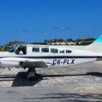 10 Killed After Flamingo Air Cessna 402 Crashes Near North Andros Airport In Bahamas SEO DES: Flamingo Air's Cessna 402, operating a scheduled flight from Nassau when it crashed, killing 10; Da Pond Band members reportedly were among the victims SOCIAL: A Flamingo Air Cessna 402 (C6-FLX) crashed while approaching San Andros Airport in North Andros, Bahamas, on July 10, 2026, killing all 10 people on board after an initially reported survivor later died. The aircraft was operating a scheduled flight from Nassau when it went down shortly before landing. The cause remains under investigation, with the AIAA leading the probe. In response, Bahamian authorities suspended Flamingo Air's Air Operator Certificate after the fatal crash and a separate same-day incident involving another Flamingo Air aircraft that caught fire after safely returning to Nassau. Several victims were confirmed to be members of the Bahamian music group Da Pond Band, while Prime Minister Philip Davis described the tragedy as a national day of mourning. North Andros, Bahamas: A domestic passenger flight operated by Flamingo Air crashed while approaching San Andros Airport in North Andros, Bahamas, on July 10, killing all 10 people on board in one of the country's deadliest aviation accidents in recent years. The tragedy occurred on the Bahamas' 53rd Independence Day, prompting the government to suspend the airline's operations pending a safety investigation. The aircraft, a Cessna 402 registered C6-FLX, had departed Lynden Pindling International Airport (NAS) in Nassau and was operating a scheduled domestic service to San Andros Airport (SAQ) when it crashed shortly before landing in North Andros at around 1 p.m. local time, according to the Bahamas' Aircraft Accident Investigation Authority (AIAA). Early reports suggested there had been a survivor, but Prime Minister Philip Brave Davis later confirmed that the individual succumbed to injuries, bringing the death toll to 10. Authorities confirmed that the flight was carrying nine passengers and one pilot. The AIAA initially reported a lower passenger count while emergency response operations were underway, but the government later clarified the final number of occupants. Emergency services, including the Royal Bahamas Police Force and local responders, were dispatched to the crash site shortly after the accident. Investigators have not yet determined what caused the aircraft to crash. Officials have confirmed only that the aircraft went down while approaching San Andros Airport after departing Nassau. The wreckage came to rest in vegetation near the airport, and investigators have begun examining the site, the aircraft, maintenance records and operational data to determine the sequence of events. The identities of all those killed have not been officially released by authorities, as family notifications were still ongoing. However, the Bahamas Musicians and Entertainers Union confirmed that several victims were members of the well-known Bahamian music group Da Pond Band, along with a DJ associated with the group. The union described the loss as a devastating blow to the country's entertainment community and paid tribute to the musicians' contribution to Bahamian culture. Some media outlets later identified several of the victims as members of Da Pond Band, including vocalist Travis Johnson, keyboardist Giovanni McKenzie, guitarist Rashad Storr, along with Quinton Myers, Mateo Winder, Macaro Rolle, and pilot Franklyn Cambridge. However, these names have not yet been officially confirmed by the Bahamian government or the AIAA, and authorities continue to withhold the complete passenger manifest pending formal identification procedures. Speaking during a press conference, Prime Minister Philip Davis said the nation had awakened to an unimaginable tragedy on what was meant to be a day of celebration. "We gather beneath a cloud of great sorrow." He added, "It has become a day of mourning." Extending condolences to the victims' families, Davis said, "To every family that has received the devastating news, that someone they love will not be coming home, we offer our deepest condolences." The crash also triggered immediate regulatory action against Flamingo Air. The Ministry of Energy, Utilities and Aviation announced the temporary suspension of the airline's Air Operator Certificate (AOC) as a precautionary safety measure while investigators examine the accident. Officials emphasized that the suspension does not indicate the cause of the crash but is intended to ensure public safety during the investigation. Energy, Utilities and Aviation Minister JoBeth Coleby-Davis revealed that the decision to suspend the airline followed two separate safety incidents involving Flamingo Air on the same day. Earlier on July 10, another Flamingo Air aircraft operating a flight to Mayaguana experienced a pilot-reported technical concern and returned safely to Nassau. After landing, passengers disembarked normally, but the aircraft subsequently caught fire while on the ground. No injuries were reported in that incident, which is also under investigation. Authorities said the combination of the fatal crash and the earlier aircraft fire prompted the precautionary suspension of the airline's operations. Flamingo Air issued a statement expressing condolences to the families of those who lost their lives and said it is cooperating fully with investigators. The airline said its focus remains on supporting the victims' families and assisting authorities as the investigation progresses. The investigation is being led by the Aircraft Accident Investigation Authority (AIAA) of The Bahamas with support from other national agencies. Investigators are expected to examine the aircraft's maintenance history, operational records, weather conditions, pilot qualifications and other evidence before issuing preliminary findings. No official cause has yet been released.