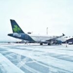 Aer Lingus To Cut Up To 500 Jobs And Trim Flight Network In Major Cost Restructuring SEO DES: According to the airline, approximately 140 cabin crew positions, 70 pilot roles and around 290 head office jobs are expected to be affected SOCIAL: Aer Lingus has announced a major restructuring programme that could put up to 500 jobs at risk, alongside a 6% reduction in flying capacity, as it seeks to improve profitability amid rising fuel costs, supply chain challenges and increased competition. Staff were informed on 13 July 2026, with the plan publicly announced on 16 July, triggering a six-week consultation process. The airline will discontinue routes from Dublin to Denver, Minneapolis, Las Vegas and Split, while Seattle, Frankfurt, Hamburg and Malta will become summer-only services. The changes, beginning in late September 2026 and extending into summer 2027, will also reduce the use of two Airbus A330s and four A320s. Aer Lingus is targeting a 12–15% operating margin, up from 11.1% in 2025, with CEO Lynne Embleton saying the transformation will strengthen the airline's long-term competitiveness and resilience. Dublin, Ireland: Aer Lingus has unveiled a sweeping restructuring programme that could place up to 500 jobs at risk as the Irish flag carrier seeks to improve profitability amid rising fuel costs, intense competition and a challenging operating environment. The airline confirmed the proposal on 16 July 2026, after informing employees internally earlier in the week. Staff were briefed on 13 July, with a formal announcement issued publicly three days later as Aer Lingus began a consultation process with employees and trade unions. The restructuring plan includes a 6% reduction in overall flying capacity, affecting both short-haul and long-haul operations, alongside measures to reduce supplier costs and improve productivity. Aer Lingus said the programme is designed to strengthen the airline's long-term financial position and make the business more attractive for future investment. According to the airline, approximately 140 cabin crew positions, 70 pilot roles and around 290 head office jobs are expected to be affected, although the final number of redundancies will depend on the outcome of consultations with employee representatives. The carrier currently employs around 6,000 people. Any customers that will be impacted by network changes will be "contacted directly and provided with re-accommodation or refund options," the airline said in a statement. Aer Lingus said changes will begin to take effect from late September 2026, continuing into summer 2027. The proposed changes to routes are: Dublin to Denver will be discontinued after 28/09/26 Dublin to Minneapolis will be discontinued after 24/10/26 Dublin to Las Vegas will be discontinued after 03/12/26 Dublin to Seattle will be a summer-only operation after 24/10/26 Dublin to Split will be discontinued after 29/09/26 Dublin to Frankfurt will be a summer-only operation after 02/11/26 Dublin to Hamburg will be a summer-only operation after 02/11/26 Dublin to Malta will be a summer-only operation after 03/11/26 Linked to these network changes, there will be a reduction in the use of two A330 aircraft and four A320 aircraft for peak summer 2027. The airline is also reviewing additional lower-margin routes as it reshapes its network. Aer Lingus said the restructuring reflects mounting financial pressures, including elevated jet fuel prices driven by geopolitical tensions in the Middle East, particularly the U.S.-Iran conflict, continued supply chain challenges and increasing competition across the transatlantic market. The measures follow a profit warning issued by parent company International Airlines Group (IAG) in May, when the group warned that higher fuel costs and supply disruptions would have a greater impact on earnings than previously anticipated. The airline is targeting a medium-term operating margin of 12% to 15%, compared with an operating margin of 11.1% in 2025. Aer Lingus noted that fellow airlines British Airways and Iberia have already achieved operating margins above 15%, highlighting the gap it intends to close through the transformation programme. In a statement, Chief Executive Lynne Embleton said the airline's restructuring is intended to strengthen its long-term competitiveness. "Our accelerated transformation aims to ... ensure the airline is a strong investment case and able to weather the turbulence in our industry." Aer Lingus said the review is focused on improving efficiency while preserving the airline's long-term growth ambitions. The carrier operates more than 100 routes between Europe and North America, making transatlantic services a key part of its network strategy. Primary Sources: Reuters: https://www.reuters.com/business/world-at-work/irish-airline-aer-lingus-plans-500-job-cuts-fuel-prices-soar-2026-07-16/?utm_source=chatgpt.com The Irish Times: https://www.irishtimes.com/business/2026/07/16/aer-lingus-to-cut-up-to-500-jobs/?utm_source=chatgpt.com RTE: https://www.rte.ie/news/2026/0716/1583614-aer-lingus-jobs/ Secondary Sources: Bloomberg: https://www.bloomberg.com/news/articles/2026-07-16/aer-lingus-looks-to-cut-500-jobs-as-airline-faces-rising-costs BBC: https://www.bbc.com/news/articles/ceqe52l4yr4o