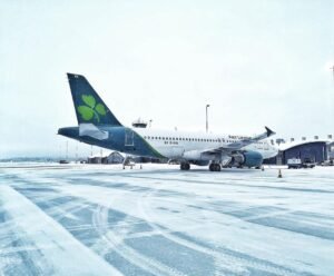 Aer Lingus To Cut Up To 500 Jobs And Trim Flight Network In Major Cost Restructuring SEO DES: According to the airline, approximately 140 cabin crew positions, 70 pilot roles and around 290 head office jobs are expected to be affected SOCIAL: Aer Lingus has announced a major restructuring programme that could put up to 500 jobs at risk, alongside a 6% reduction in flying capacity, as it seeks to improve profitability amid rising fuel costs, supply chain challenges and increased competition. Staff were informed on 13 July 2026, with the plan publicly announced on 16 July, triggering a six-week consultation process. The airline will discontinue routes from Dublin to Denver, Minneapolis, Las Vegas and Split, while Seattle, Frankfurt, Hamburg and Malta will become summer-only services. The changes, beginning in late September 2026 and extending into summer 2027, will also reduce the use of two Airbus A330s and four A320s. Aer Lingus is targeting a 12–15% operating margin, up from 11.1% in 2025, with CEO Lynne Embleton saying the transformation will strengthen the airline's long-term competitiveness and resilience. Dublin, Ireland: Aer Lingus has unveiled a sweeping restructuring programme that could place up to 500 jobs at risk as the Irish flag carrier seeks to improve profitability amid rising fuel costs, intense competition and a challenging operating environment. The airline confirmed the proposal on 16 July 2026, after informing employees internally earlier in the week. Staff were briefed on 13 July, with a formal announcement issued publicly three days later as Aer Lingus began a consultation process with employees and trade unions. The restructuring plan includes a 6% reduction in overall flying capacity, affecting both short-haul and long-haul operations, alongside measures to reduce supplier costs and improve productivity. Aer Lingus said the programme is designed to strengthen the airline's long-term financial position and make the business more attractive for future investment. According to the airline, approximately 140 cabin crew positions, 70 pilot roles and around 290 head office jobs are expected to be affected, although the final number of redundancies will depend on the outcome of consultations with employee representatives. The carrier currently employs around 6,000 people. Any customers that will be impacted by network changes will be "contacted directly and provided with re-accommodation or refund options," the airline said in a statement. Aer Lingus said changes will begin to take effect from late September 2026, continuing into summer 2027. The proposed changes to routes are: Dublin to Denver will be discontinued after 28/09/26 Dublin to Minneapolis will be discontinued after 24/10/26 Dublin to Las Vegas will be discontinued after 03/12/26 Dublin to Seattle will be a summer-only operation after 24/10/26 Dublin to Split will be discontinued after 29/09/26 Dublin to Frankfurt will be a summer-only operation after 02/11/26 Dublin to Hamburg will be a summer-only operation after 02/11/26 Dublin to Malta will be a summer-only operation after 03/11/26 Linked to these network changes, there will be a reduction in the use of two A330 aircraft and four A320 aircraft for peak summer 2027. The airline is also reviewing additional lower-margin routes as it reshapes its network. Aer Lingus said the restructuring reflects mounting financial pressures, including elevated jet fuel prices driven by geopolitical tensions in the Middle East, particularly the U.S.-Iran conflict, continued supply chain challenges and increasing competition across the transatlantic market. The measures follow a profit warning issued by parent company International Airlines Group (IAG) in May, when the group warned that higher fuel costs and supply disruptions would have a greater impact on earnings than previously anticipated. The airline is targeting a medium-term operating margin of 12% to 15%, compared with an operating margin of 11.1% in 2025. Aer Lingus noted that fellow airlines British Airways and Iberia have already achieved operating margins above 15%, highlighting the gap it intends to close through the transformation programme. In a statement, Chief Executive Lynne Embleton said the airline's restructuring is intended to strengthen its long-term competitiveness. "Our accelerated transformation aims to ... ensure the airline is a strong investment case and able to weather the turbulence in our industry." Aer Lingus said the review is focused on improving efficiency while preserving the airline's long-term growth ambitions. The carrier operates more than 100 routes between Europe and North America, making transatlantic services a key part of its network strategy. Primary Sources: Reuters: https://www.reuters.com/business/world-at-work/irish-airline-aer-lingus-plans-500-job-cuts-fuel-prices-soar-2026-07-16/?utm_source=chatgpt.com The Irish Times: https://www.irishtimes.com/business/2026/07/16/aer-lingus-to-cut-up-to-500-jobs/?utm_source=chatgpt.com RTE: https://www.rte.ie/news/2026/0716/1583614-aer-lingus-jobs/ Secondary Sources: Bloomberg: https://www.bloomberg.com/news/articles/2026-07-16/aer-lingus-looks-to-cut-500-jobs-as-airline-faces-rising-costs BBC: https://www.bbc.com/news/articles/ceqe52l4yr4o