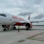 New Delhi, India: Air India’s A320neo operating flight AI2379 from Phuket to Delhi suffered multiple technical and mechanical glitches, including three hydraulic-system failures, an autopilot disconnect and a flight-control stall warning before suddenly losing around 300 feet in altitude, according to information reported by PTI, citing sources. The aircraft encountered turbulence during the August 4 incident, which left 17 people injured. The aircraft, an Airbus A320neo registered VT-EXO, was cruising from Phuket, Thailand, to Delhi when the sudden altitude loss occurred. According to PTI, the autopilot disconnected during the flight, after which the co-pilot manually regained control. A flight-control stall warning then appeared, while several indicator switches briefly went off. Sources also told PTI that the aircraft experienced multiple other technical and mechanical glitches alongside the turbulence. The latest information indicates that the aircraft experienced three separate hydraulic failures. Hydraulic systems use pressurised fluid to operate critical aircraft components, including flight-control systems, making the reported failures a significant part of the ongoing investigation. The crew managed to stabilise the aircraft and subsequently continued the flight to Delhi, where it landed safely. Air India said the aircraft experienced a sudden loss of altitude during cruise before stabilising and continuing normally to Delhi. The flight carried 137 passengers, including three infants, and eight crew members. At least 17 people, 13 passengers and four crew members were reported injured and taken for medical evaluation. The Aircraft Accident Investigation Bureau (AAIB) is investigating the occurrence as a serious incident under ICAO Annex 13, which governs aircraft accident and incident investigations. The aircraft’s flight data recorder and cockpit voice recorder have been secured for examination as investigators work to establish what triggered the altitude loss and the reported technical problems. Airbus has confirmed that it is sending specialists to India to provide technical assistance to the investigation. The manufacturer said it was supporting the relevant investigating authorities in accordance with ICAO Annex 13. France’s Bureau of Enquiry and Analysis for Civil Aviation Safety (BEA) is also joining the investigation because the A320 is manufactured in France. Teams from Airbus and BEA are expected to assist the AAIB as investigators examine the aircraft and recorded flight data. The latest technical findings remain preliminary and have not been established as the final cause of the incident. The reported triple hydraulic failures and other malfunctions are based on sources cited by PTI; they are not yet findings formally released by the AAIB. The investigation is continuing, with technical specialists expected to examine the aircraft’s systems and recorded data before any conclusions are reached. A separate line of investigation concerns the pilot-in-command’s post-flight psychoactive-substance screening. The Civil Aviation Ministry said an initial screening result was “not negative” and required confirmatory laboratory testing. The pilot’s sample was subsequently sent for further analysis, and the final confirmatory result was still awaited in the latest reports. The ministry has not disclosed what substance, if any, was indicated by the initial screening. The distinction is important because an initial “not negative” screening result does not by itself establish drug use. The pilots’ body, ALPA India, has said that commonly used over-the-counter medicines can also produce a non-negative result in psychoactive-substance screening. The confirmatory laboratory test is therefore expected to determine whether the initial result was caused by a prohibited substance or another factor. Both pilots have been taken off flying duties pending the investigation, according to reporting on the ministry’s action. Air India has said it was aware that post-flight screening had been conducted under applicable procedures but had not initially been informed of the results. The final laboratory findings remain an important part of determining whether the screening result has any connection to the August 4 occurrence. The incident was initially widely described as a severe-turbulence event after passengers and crew were thrown from their seats during the sudden altitude change. The newer information from PTI, however, adds a series of reported technical malfunctions including autopilot disconnection, a flight-control stall warning, briefly extinguished indicators and three hydraulic failures to the investigation. Whether these issues caused, contributed to or merely coincided with the altitude loss remains to be established by the AAIB probe. For now, the cause remains officially undetermined. Investigators are examining the aircraft’s systems, flight-recorded data, cockpit recordings and other evidence, with Airbus and France’s BEA assisting the AAIB. The outcome of the pilot’s confirmatory psychoactive-substance test is also awaited. Until those investigations are completed, the reported technical failures and the initial screening result should not be treated as established causes of the incident.