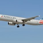 Dallas, United States: A passenger's laptop caught fire aboard American Airlines Flight 2398 while the Airbus A321 was approaching Dallas-Fort Worth International Airport (DFW) from Atlanta on August 21, prompting a cabin emergency and an immediate response from the flight crew. Flight 2398 was operating from Hartsfield-Jackson Atlanta International Airport to Dallas-Fort Worth International Airport with 133 people on board when smoke and fire were reported from a passenger's electronic device during the landing phase. The aircraft was an Airbus A321. According to air traffic control audio, the pilot initially reported a fire in the rear section of the aircraft while flight attendants were attempting to extinguish it. The pilot told controllers, "Cabin fire in the back of the airplane," as the crew worked to bring the situation under control. Passenger Jessica Irgens told CBS News that the incident began roughly 30 minutes before landing when another passenger's laptop started smoking and then caught fire. She said she was sitting about two rows from the device and moved toward the rear of the aircraft after smoke began filling the cabin. According to Irgens, the laptop's owner placed the burning device in the aisle while passengers attempted to assist. She said the crew managed to secure the device in a thermal containment bag within about five minutes. The pilot subsequently told air traffic control, "I think we have about four to five passengers that were burned by the laptop," adding that "The laptop contained about mid-aircraft." These figures came from the pilot's initial report and should not be treated as the final confirmed injury count. American Airlines confirmed that the aircraft landed safely at DFW and said the incident involved smoke from a customer's device during landing. The airline said, "American Airlines flight 2398 landed safely at DFW after reports of smoke from a customer's device during landing." It added, "We thank our crew for their professionalism and swift response to quickly contain the device." The airline also said the aircraft taxied to the gate under its own power and that emergency personnel met the aircraft upon arrival in accordance with standard procedure. One passenger received medical attention at the scene and was subsequently released, according to American Airlines. DFW separately confirmed that emergency crews responded and one patient was treated and released. The Federal Aviation Administration said flight attendants contained the fire using a thermal containment bag. The Airbus A321 landed at DFW at approximately 6:55 p.m. local time, and the FAA said it was investigating the incident. The exact technical failure that caused the laptop to ignite has not been publicly established. The available official information identifies the source as a customer's device, while the FAA has separately warned that lithium-ion batteries can undergo a process known as thermal runaway. Such an event can occur when a battery is damaged, overheated, exposed to water, overcharged or improperly packed. The incident therefore did not result in an emergency diversion or emergency landing at an alternate airport. Flight 2398 continued to Dallas-Fort Worth after the cabin crew contained the device and landed safely at its scheduled destination. The aircraft then reached the gate under its own power, where emergency personnel responded.