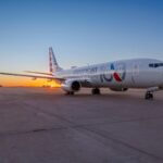 Phoenix, United States: A potential mid-air collision was averted near Phoenix Sky Harbor International Airport on August 14, 2026, after two American Airlines Boeing 737-800s were simultaneously operating under the same “American 2482” callsign while flying in opposite directions between Phoenix and Chicago. One aircraft was arriving at Phoenix from Chicago O’Hare International Airport, while another had just departed Phoenix for Chicago. The unusual overlap occurred after the inbound Flight 2482 was delayed by weather, prompting American Airlines to use another aircraft already at Phoenix so passengers waiting for the outbound service could depart on schedule. Because Flight 2482 normally operates as a Chicago-Phoenix round trip using the same flight number, the replacement aircraft also operated under the 2482 identification. The resulting callsign duplication placed both aircraft in the same area of airspace while communicating on the same frequency. Flightradar24 reported that the arriving aircraft was descending through about 11,000 feet while the departing aircraft was climbing toward 9,000 feet when the duplication was recognized. The FAA said the aircraft maintained the required separation throughout the incident. The Phoenix air traffic controller quickly recognized the problem and began distinguishing the two aircraft as “American 2482 on the arrival” and “American 2482 on the departure.” The controller then kept the arriving aircraft above the departing aircraft and prevented the departure from climbing into the arrival’s altitude, maintaining vertical separation as their flight paths converged. The controller also alerted both crews to the other aircraft. Reports said the pilots were able to see each other while they were still miles apart, providing an additional layer of awareness as the two aircraft crossed paths. No source has publicly released an exact minimum horizontal distance between the aircraft, and the FAA has confirmed only that required separation was maintained. The incident was captured in air traffic control audio published by ATC.com and subsequently highlighted by media outlets. After the departing aircraft had cleared the area, the controller said, “I’ve been working air traffic for 25 years. I’ve never seen two aircraft pretty much merge with the same call sign. That’s pretty incredible.” The arriving pilot later complimented the controller, saying “nice work.” The controller responded, “It could have been disastrous, but I’m glad it worked out.” The precise passenger and crew numbers aboard the two Boeing 737-800s have not been publicly disclosed by the FAA or American Airlines. Both aircraft completed their flights safely, with no injuries or collision reported. American Airlines said, “The diligence and professionalism of air traffic controllers and our pilots ensured required separation was always maintained and the issue was identified and addressed. Both flights continued safely and without incident.” Aviation safety expert Steve Arroyo, a former airline dispatcher and pilot, said the incident likely resulted from an oversight within the airline’s dispatch operation. He told Associated Press that someone should have identified that the two aircraft would be airborne at the same time under identical flight numbers. Arroyo described the event as an example of the aviation system’s ability to recover from an error once it reaches another safety layer. The FAA and American Airlines are investigating how the duplicate callsign was allowed to occur. The investigation will determine how the delayed inbound flight and the replacement outbound aircraft were planned and identified, and why the normal safeguards for avoiding simultaneous use of the same callsign did not prevent the situation.