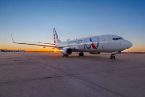 Phoenix, United States: A potential mid-air collision was averted near Phoenix Sky Harbor International Airport on August 14, 2026, after two American Airlines Boeing 737-800s were simultaneously operating under the same “American 2482” callsign while flying in opposite directions between Phoenix and Chicago. One aircraft was arriving at Phoenix from Chicago O’Hare International Airport, while another had just departed Phoenix for Chicago. The unusual overlap occurred after the inbound Flight 2482 was delayed by weather, prompting American Airlines to use another aircraft already at Phoenix so passengers waiting for the outbound service could depart on schedule. Because Flight 2482 normally operates as a Chicago-Phoenix round trip using the same flight number, the replacement aircraft also operated under the 2482 identification. The resulting callsign duplication placed both aircraft in the same area of airspace while communicating on the same frequency. Flightradar24 reported that the arriving aircraft was descending through about 11,000 feet while the departing aircraft was climbing toward 9,000 feet when the duplication was recognized. The FAA said the aircraft maintained the required separation throughout the incident. The Phoenix air traffic controller quickly recognized the problem and began distinguishing the two aircraft as “American 2482 on the arrival” and “American 2482 on the departure.” The controller then kept the arriving aircraft above the departing aircraft and prevented the departure from climbing into the arrival’s altitude, maintaining vertical separation as their flight paths converged. The controller also alerted both crews to the other aircraft. Reports said the pilots were able to see each other while they were still miles apart, providing an additional layer of awareness as the two aircraft crossed paths. No source has publicly released an exact minimum horizontal distance between the aircraft, and the FAA has confirmed only that required separation was maintained. The incident was captured in air traffic control audio published by ATC.com and subsequently highlighted by media outlets. After the departing aircraft had cleared the area, the controller said, “I’ve been working air traffic for 25 years. I’ve never seen two aircraft pretty much merge with the same call sign. That’s pretty incredible.” The arriving pilot later complimented the controller, saying “nice work.” The controller responded, “It could have been disastrous, but I’m glad it worked out.” The precise passenger and crew numbers aboard the two Boeing 737-800s have not been publicly disclosed by the FAA or American Airlines. Both aircraft completed their flights safely, with no injuries or collision reported. American Airlines said, “The diligence and professionalism of air traffic controllers and our pilots ensured required separation was always maintained and the issue was identified and addressed. Both flights continued safely and without incident.” Aviation safety expert Steve Arroyo, a former airline dispatcher and pilot, said the incident likely resulted from an oversight within the airline’s dispatch operation. He told Associated Press that someone should have identified that the two aircraft would be airborne at the same time under identical flight numbers. Arroyo described the event as an example of the aviation system’s ability to recover from an error once it reaches another safety layer. The FAA and American Airlines are investigating how the duplicate callsign was allowed to occur. The investigation will determine how the delayed inbound flight and the replacement outbound aircraft were planned and identified, and why the normal safeguards for avoiding simultaneous use of the same callsign did not prevent the situation.