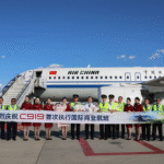 international operations. Beijing, China: Air China’s COMAC C919 completed its first scheduled international passenger service on August 12, 2026, when flight CA723 departed Beijing Capital International Airport at about 3 p.m. for Ulaanbaatar, Mongolia, marking the first time the Chinese-developed narrowbody aircraft carried passengers on a regular route between China and another country. The aircraft arrived at Chinggis Khaan International Airport at about 4:58 p.m. with 121 passengers onboard. China operates the route daily, with CA723 scheduled to depart Beijing at 3 p.m. and arrive in Ulaanbaatar at 5:15 p.m., while return flight CA724 departs Ulaanbaatar at 6:30 p.m. and reaches Beijing at 8:35 p.m., with all times local. The Beijing-Ulaanbaatar operation marks the latest stage in the C919’s commercial development since the aircraft entered airline service in 2023. The C919 was developed by Commercial Aircraft Corporation of China (COMAC), the country’s state-owned commercial aircraft manufacturer, as China’s first domestically developed narrowbody mainline jet built to international airworthiness standards. COMAC lists the aircraft’s basic configuration at 158 to 192 seats, with a range of 4,075 to 5,555 kilometers. The programme reached a major milestone on November 2, 2015, when the first C919 completed final assembly and rolled out, followed by its maiden flight on May 5, 2017. The aircraft received its type certificate from the Civil Aviation Administration of China (CAAC) on September 29, 2022, and the first C919 was delivered to launch customer China Eastern Airlines on December 9, 2022. China Eastern subsequently operated the aircraft’s first commercial passenger flight on May 28, 2023, completing the development, manufacturing, certification and commercial-entry stages of the programme. The C919’s international exposure began before Wednesday’s scheduled service. In February 2024, a China Eastern C919 flew to Singapore for the Singapore Airshow, marking the aircraft’s first appearance at the event. COMAC then conducted a series of demonstration flights in Southeast Asia in 2024, including visits to Vietnam, Laos, Cambodia, Malaysia and Indonesia, to assess the aircraft’s compatibility with local airports, ground-support equipment and operating procedures. The C919 programme has also expanded beyond the original aircraft configuration. On July 29, 2026, COMAC conducted the first flight of the C919 high-altitude variant at Shanghai Pudong International Airport. The aircraft flew for 1 hour and 59 minutes and completed all planned test items. COMAC said the variant incorporates a shortened fuselage and system modifications designed for high-altitude operations. The aircraft remains heavily dependent on an international supply chain. Its LEAP-1C engines are supplied by CFM International, the GE Aerospace-Safran joint venture, while Honeywell, Collins Aerospace, Parker Hannifin, Moog and other Western companies supply systems and equipment. Air Data News reported that this dependence became particularly visible during the 2025 US-China trade dispute, when Washington temporarily suspended export licenses involving technology and engines destined for COMAC before the restrictions were later lifted. The C919’s dependence on foreign technology has also been a factor in China’s efforts to develop domestic alternatives. Replacing established Western systems requires more than manufacturing substitute components, because replacement systems must meet requirements for reliability, weight, fuel efficiency, durability and certification. Production has been another major part of the programme’s development. COMAC delivered 15 C919 aircraft to customers in 2025, well below an earlier target of 75 aircraft. South China Morning Post reported in January 2026 that COMAC was targeting at least 28 deliveries during 2026 and that, if production reached the expected pace, the manufacturer could produce one C919 every 10 to 15 days. The report said two aircraft had already taken shape during the first three weeks of 2026 and were undergoing delivery procedures. COMAC has also been expanding its production infrastructure. ChinaTravelNews reported in July 2026 that deliveries were expected to reach at least 28 C919 aircraft in 2026, with production potentially increasing to one aircraft every 10 to 15 days. The second phase of the C919 final-assembly-line expansion in Shanghai Pudong is expected to take annual production capacity above 100 aircraft, while COMAC has set a longer-term target of 200 aircraft a year by 2029. Earlier production plans were even more ambitious. In March 2025, COMAC raised its planned C919 production capacity for that year to 75 aircraft from an earlier target of 50, while setting a 200-aircraft annual production objective for 2029. The actual 2025 delivery figure subsequently came in at 15 aircraft. The C919’s order book has been concentrated largely among Chinese airlines. By December 2024, Air Data News reported that Air China, China Southern and China Eastern together had ordered 306 C919 aircraft, although only 14 had been delivered to the three carriers at that point. COMAC was simultaneously exploring potential overseas customers in Indonesia, Cambodia and Kazakhstan, while Vietnam Airlines, AirAsia and Brazil’s Total Linhas A
