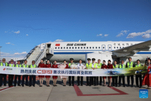 international operations. Beijing, China: Air China’s COMAC C919 completed its first scheduled international passenger service on August 12, 2026, when flight CA723 departed Beijing Capital International Airport at about 3 p.m. for Ulaanbaatar, Mongolia, marking the first time the Chinese-developed narrowbody aircraft carried passengers on a regular route between China and another country. The aircraft arrived at Chinggis Khaan International Airport at about 4:58 p.m. with 121 passengers onboard. China operates the route daily, with CA723 scheduled to depart Beijing at 3 p.m. and arrive in Ulaanbaatar at 5:15 p.m., while return flight CA724 departs Ulaanbaatar at 6:30 p.m. and reaches Beijing at 8:35 p.m., with all times local. The Beijing-Ulaanbaatar operation marks the latest stage in the C919’s commercial development since the aircraft entered airline service in 2023. The C919 was developed by Commercial Aircraft Corporation of China (COMAC), the country’s state-owned commercial aircraft manufacturer, as China’s first domestically developed narrowbody mainline jet built to international airworthiness standards. COMAC lists the aircraft’s basic configuration at 158 to 192 seats, with a range of 4,075 to 5,555 kilometers. The programme reached a major milestone on November 2, 2015, when the first C919 completed final assembly and rolled out, followed by its maiden flight on May 5, 2017. The aircraft received its type certificate from the Civil Aviation Administration of China (CAAC) on September 29, 2022, and the first C919 was delivered to launch customer China Eastern Airlines on December 9, 2022. China Eastern subsequently operated the aircraft’s first commercial passenger flight on May 28, 2023, completing the development, manufacturing, certification and commercial-entry stages of the programme. The C919’s international exposure began before Wednesday’s scheduled service. In February 2024, a China Eastern C919 flew to Singapore for the Singapore Airshow, marking the aircraft’s first appearance at the event. COMAC then conducted a series of demonstration flights in Southeast Asia in 2024, including visits to Vietnam, Laos, Cambodia, Malaysia and Indonesia, to assess the aircraft’s compatibility with local airports, ground-support equipment and operating procedures. The C919 programme has also expanded beyond the original aircraft configuration. On July 29, 2026, COMAC conducted the first flight of the C919 high-altitude variant at Shanghai Pudong International Airport. The aircraft flew for 1 hour and 59 minutes and completed all planned test items. COMAC said the variant incorporates a shortened fuselage and system modifications designed for high-altitude operations. The aircraft remains heavily dependent on an international supply chain. Its LEAP-1C engines are supplied by CFM International, the GE Aerospace-Safran joint venture, while Honeywell, Collins Aerospace, Parker Hannifin, Moog and other Western companies supply systems and equipment. Air Data News reported that this dependence became particularly visible during the 2025 US-China trade dispute, when Washington temporarily suspended export licenses involving technology and engines destined for COMAC before the restrictions were later lifted. The C919’s dependence on foreign technology has also been a factor in China’s efforts to develop domestic alternatives. Replacing established Western systems requires more than manufacturing substitute components, because replacement systems must meet requirements for reliability, weight, fuel efficiency, durability and certification. Production has been another major part of the programme’s development. COMAC delivered 15 C919 aircraft to customers in 2025, well below an earlier target of 75 aircraft. South China Morning Post reported in January 2026 that COMAC was targeting at least 28 deliveries during 2026 and that, if production reached the expected pace, the manufacturer could produce one C919 every 10 to 15 days. The report said two aircraft had already taken shape during the first three weeks of 2026 and were undergoing delivery procedures. COMAC has also been expanding its production infrastructure. ChinaTravelNews reported in July 2026 that deliveries were expected to reach at least 28 C919 aircraft in 2026, with production potentially increasing to one aircraft every 10 to 15 days. The second phase of the C919 final-assembly-line expansion in Shanghai Pudong is expected to take annual production capacity above 100 aircraft, while COMAC has set a longer-term target of 200 aircraft a year by 2029. Earlier production plans were even more ambitious. In March 2025, COMAC raised its planned C919 production capacity for that year to 75 aircraft from an earlier target of 50, while setting a 200-aircraft annual production objective for 2029. The actual 2025 delivery figure subsequently came in at 15 aircraft. The C919’s order book has been concentrated largely among Chinese airlines. By December 2024, Air Data News reported that Air China, China Southern and China Eastern together had ordered 306 C919 aircraft, although only 14 had been delivered to the three carriers at that point. COMAC was simultaneously exploring potential overseas customers in Indonesia, Cambodia and Kazakhstan, while Vietnam Airlines, AirAsia and Brazil’s Total Linhas A