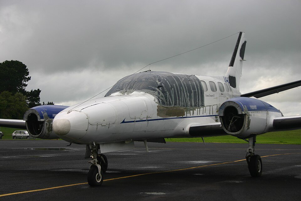 Alaska, United States: A twin-engine Cessna 441 charter aircraft carrying eight people crashed near the remote Cape Newenham Long Range Radar Site in western Alaska on Thursday, August 20, while approaching Cape Newenham. The aircraft, operated by Security Aviation, had departed Ted Stevens Anchorage International Airport and was headed to Cape Newenham when it went down west of Cape Newenham LRRS Airport at about 12:15 p.m. local time. NTSB Alaska region chief Clint Johnson confirmed that two pilots and six passengers were aboard, but officials had not released their condition or confirmed any fatalities or survivors at the time of reporting. The Alaska Rescue Coordination Center launched a search-and-rescue mission after receiving a report of an “aircraft incident” near the Cape Newenham Long Range Radar Site. Johnson, the NTSB’s Alaska region chief, provided the passenger and crew count to The Associated Press and said he did not immediately have details on the status of those aboard. AP reported that Johnson said the aircraft was believed to have crashed early Thursday afternoon while on approach to Cape Newenham. “The information received so far is preliminary,” Johnson said. According to the FAA, the aircraft crashed west of Cape Newenham LRRS Airport at 12:15 p.m. local time. The Cessna 441 is a twin-engine turboprop aircraft. Security Aviation, an Anchorage-based charter operator, lists the Cessna 441 Conquest II among its fleet and says the aircraft is suited for operations across Alaska, including airports with gravel runways and challenging weather and airport environments. The aircraft was believed to have gone down during its approach to Cape Newenham rather than after landing. However, authorities have not disclosed what caused the aircraft to crash, whether the crew issued an emergency call, whether there was a mechanical problem, or what the weather conditions were at the time of the accident. None of those factors has been identified by investigators as a cause. The crash occurred near the Cape Newenham Long Range Radar Site, a remote facility in western Alaska. The Alaska Rescue Coordination Center said it began a search-and-rescue operation after receiving a report of an “aircraft incident” in the area. Authorities had not publicly confirmed whether rescuers had reached all eight occupants, whether anyone had survived, or whether there were fatalities. NTSB officials also had not released the identities of the pilots or passengers. The lack of information was attributed in part to the remote location of the crash site and the early stage of the response. The NTSB is leading the investigation, with the FAA assisting. Investigators are expected to establish the aircraft’s flight path, examine the wreckage and determine what led to the crash. No cause has been announced, and the NTSB has stressed that the information available so far remains preliminary.