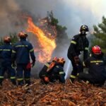 Athens, Greece: A Danish pilot and a Greek fire service liaison officer were killed after two firefighting helicopters collided mid-air while battling a major wildfire west of Athens on Sunday, marking another tragedy as Greece faces multiple fast-moving wildfires amid extreme weather conditions. The collision occurred over the Psatha area near Porto Germeno, west of the Greek capital, where emergency crews were battling a wind-driven wildfire that has been burning since Friday. According to Greek authorities, both helicopters were Bell firefighting helicopters operating on aerial water-dropping missions over the fire zone. Each helicopter carried two crew members. One aircraft crashed following the collision, killing its Danish pilot and a Greek fire service liaison officer. The second helicopter managed to make an emergency landing, and its occupants, a British pilot and a Greek crew member survived with minor injuries. Both survivors were transported to hospital for treatment. Authorities have not yet released the identities of the deceased or the survivors. The exact cause of the mid-air collision remains under investigation. Officials have not indicated whether the helicopters made physical contact during water-dropping operations or while manoeuvring over the wildfire. No preliminary findings have been released, and investigators are expected to examine flight operations, communications and weather conditions in the area. The helicopters were supporting efforts to contain a rapidly spreading wildfire near Porto Germeno, a coastal community on the Gulf of Corinth. Strong, gusting winds significantly complicated firefighting operations, limiting aircraft movements and, at times, preventing helicopters and water bombers from safely collecting seawater for repeated drops. Nearly 500 firefighters supported by 23 aircraft were deployed to combat the blaze. The fire, which ignited near Agios Vasileios on Friday, spread quickly through dry forests toward Porto Germeno and surrounding mountainous terrain west of Athens. Authorities ordered evacuations for the communities of Kandili, Agia Skepi, and Toutouli as flames advanced. Earlier in the emergency, firefighters evacuated 254 people by sea on Friday and another 12 on Saturday, with maritime evacuations becoming the safest option after smoke and flames threatened the limited road access from coastal settlements. Wildfire meteorologist Theodore Giannaros estimated the blaze had affected approximately 40 to 50 square kilometres (15–19 square miles), although Greek authorities had not issued an official burn-area estimate. Greek Prime Minister Kyriakos Mitsotakis expressed condolences following the accident. "The loss of the Greek coordinator and the Danish pilot at the time they were attempting the major fire in Porto Germeno fills us all with grief," Mitsotakis said in a statement. In a separate message, the Prime Minister also expressed his "deepest sorrow" over the deaths and extended condolences to the families, colleagues and loved ones of those killed while responding to the wildfire emergency. European Commission President Ursula von der Leyen also paid tribute to the crews, saying: "It takes a special courage to fly towards the flames." Greek authorities have launched an investigation into Sunday's helicopter collision. Officials are expected to determine the circumstances that led to the accident while aerial firefighting operations continue against multiple active wildfires across the country.