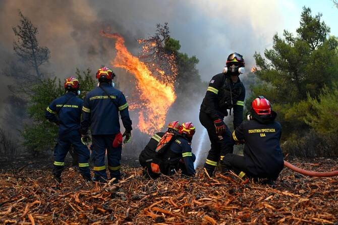 Athens, Greece: A Danish pilot and a Greek fire service liaison officer were killed after two firefighting helicopters collided mid-air while battling a major wildfire west of Athens on Sunday, marking another tragedy as Greece faces multiple fast-moving wildfires amid extreme weather conditions. The collision occurred over the Psatha area near Porto Germeno, west of the Greek capital, where emergency crews were battling a wind-driven wildfire that has been burning since Friday. According to Greek authorities, both helicopters were Bell firefighting helicopters operating on aerial water-dropping missions over the fire zone. Each helicopter carried two crew members. One aircraft crashed following the collision, killing its Danish pilot and a Greek fire service liaison officer. The second helicopter managed to make an emergency landing, and its occupants, a British pilot and a Greek crew member survived with minor injuries. Both survivors were transported to hospital for treatment. Authorities have not yet released the identities of the deceased or the survivors. The exact cause of the mid-air collision remains under investigation. Officials have not indicated whether the helicopters made physical contact during water-dropping operations or while manoeuvring over the wildfire. No preliminary findings have been released, and investigators are expected to examine flight operations, communications and weather conditions in the area. The helicopters were supporting efforts to contain a rapidly spreading wildfire near Porto Germeno, a coastal community on the Gulf of Corinth. Strong, gusting winds significantly complicated firefighting operations, limiting aircraft movements and, at times, preventing helicopters and water bombers from safely collecting seawater for repeated drops. Nearly 500 firefighters supported by 23 aircraft were deployed to combat the blaze. The fire, which ignited near Agios Vasileios on Friday, spread quickly through dry forests toward Porto Germeno and surrounding mountainous terrain west of Athens. Authorities ordered evacuations for the communities of Kandili, Agia Skepi, and Toutouli as flames advanced. Earlier in the emergency, firefighters evacuated 254 people by sea on Friday and another 12 on Saturday, with maritime evacuations becoming the safest option after smoke and flames threatened the limited road access from coastal settlements. Wildfire meteorologist Theodore Giannaros estimated the blaze had affected approximately 40 to 50 square kilometres (15–19 square miles), although Greek authorities had not issued an official burn-area estimate. Greek Prime Minister Kyriakos Mitsotakis expressed condolences following the accident. "The loss of the Greek coordinator and the Danish pilot at the time they were attempting the major fire in Porto Germeno fills us all with grief," Mitsotakis said in a statement. In a separate message, the Prime Minister also expressed his "deepest sorrow" over the deaths and extended condolences to the families, colleagues and loved ones of those killed while responding to the wildfire emergency. European Commission President Ursula von der Leyen also paid tribute to the crews, saying: "It takes a special courage to fly towards the flames." Greek authorities have launched an investigation into Sunday's helicopter collision. Officials are expected to determine the circumstances that led to the accident while aerial firefighting operations continue against multiple active wildfires across the country.