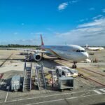 Krasnoyarsk, Russia: Hainan Airlines Flight HU753, operating from Beijing Capital International Airport in China to Manchester Airport in the United Kingdom, diverted to Krasnoyarsk International Airport in Russia on August 15 after the Airbus A330-300 developed a mechanical fault while flying over Siberia. The aircraft landed safely, with no injuries, deaths or damage reported. The flight was operated by an Airbus A330-343, registration B-304L, with 230 people on board. Flight-tracking data showed the aircraft departed Beijing for Manchester and was cruising at approximately FL340, or 34,000 feet, when the problem occurred. The aircraft was around 190 nautical miles southeast of Krasnoyarsk when it descended to approximately FL200 and diverted toward Krasnoyarsk International Airport. According to reports, the problem emerged approximately four hours into the flight. The aircraft's sensors detected the fault and the crew issued an emergency signal before diverting to Krasnoyarsk.. Russian emergency authorities had prepared for the aircraft's arrival, deploying 51 personnel and 15 vehicles. The response included 39 personnel and 11 vehicles from Russia's Ministry of Emergency Situations, according to reports. Emergency teams were positioned as a precaution, but the aircraft completed the landing without an accident. Russia's Emergencies Ministry confirmed that there were no injuries or deaths and that neither the aircraft nor airport infrastructure was damaged. English- and Chinese-speaking airport personnel were also reported to have assisted passengers and crew following the landing. Hainan Airlines confirmed the diversion and apologised to passengers. In its statement, the airline said: “On 15 August 2026, our flight HU753 (Beijing–Manchester) diverted to Krasnoyarsk International Airport in Russia due to a mechanical fault. The flight landed safely at 07:28 Beijing time.” The airline added: “The company plans to replace the aircraft to operate the onward flight. We will properly arrange passenger service support to ensure safe arrival at the destination. We sincerely apologise for any inconvenience caused to passengers.” Hainan Airlines also reiterated: “Hainan Airlines always adheres to the principles of safety first and passengers first, providing safe, comfortable and efficient services.” The exact nature of the mechanical fault has not been officially disclosed. Hainan Airlines described the problem as a “mechanical fault,” while Russian authorities referred to it as a technical malfunction. Therefore, claims that the incident involved a particular system failure should be treated cautiously. The diversion left passengers in Krasnoyarsk while Hainan Airlines arranged an onward journey. The airline said a replacement aircraft would be sent to Krasnoyarsk to continue the service to Manchester, while passenger support arrangements were being made.