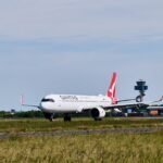 Sydney, Australia: The Australian Transport Safety Bureau (ATSB) has launched an investigation into a serious runway incursion involving two Qantas-operated aircraft at Sydney Airport after an air traffic control clearance resulted in one aircraft being instructed to cross an active runway while another was still landing. The incident occurred on 27 July 2026 at approximately 08:14 local time, and although no collision occurred, the safety watchdog has classified it as a breakdown in coordination and opened a formal investigation. According to the ATSB, the occurrence involved Qantas Flight QF124, a Boeing 737-800 registered VH-XZG, which had arrived from Queenstown, New Zealand, and QantasLink Flight QLK424D, a De Havilland Canada Dash 8 Q400 registered VH-QOC, arriving from Canberra, Australian Capital Territory. Preliminary information released by the ATSB states that after landing on Runway 25, the Boeing 737 was instructed by air traffic control to taxi and cross Runway 34L. At the same time, the Dash 8 Q400 had been cleared to land on Runway 34L and was still completing its landing roll along the active runway. As the Boeing approached the runway crossing point, air traffic controllers recognised the developing conflict. The ATSB said the 737 crew stopped the aircraft before entering Runway 34L, while the Dash 8 continued its landing roll on the runway. Because the Boeing halted short of the runway, the two aircraft remained separated and no collision occurred. No injuries or aircraft damage were reported, and both aircraft subsequently continued normal ground operations. The ATSB has not released the number of passengers or crew on board either flight. The safety bureau has opened investigation AO-2026-086 to determine the factors that led to the runway incursion. Investigators will examine the sequence of air traffic control clearances, coordination between controllers, recorded radio communications, surveillance data, aircraft movements, human factors and operational procedures. The investigation will also assess whether any broader systemic issues contributed to the occurrence. In its initial investigation notice, the ATSB described the event as involving a breakdown of coordination between aircraft movements on intersecting runways. The agency noted that evidence collection is underway, including interviews with relevant personnel and analysis of operational data. A final report is expected before the end of 2026, although the timeline may change depending on investigative findings. The incident has renewed attention on staffing pressures within Australia's air traffic control system. Recent media reports have highlighted controller shortages and increased workload at Sydney Airport, with industry representatives raising concerns over staffing levels. Airservices Australia has acknowledged workforce challenges and said it is recruiting and training additional controllers, while noting that qualification training takes several years before recruits can work independently in complex airspace. Airservices Australia confirmed it is cooperating fully with the ATSB investigation and said safety remains its highest priority. The organisation has not provided further comment while the independent investigation is ongoing. Qantas also confirmed it is assisting the ATSB and stated that both flight crews were operating in accordance with air traffic control instructions issued during the event.