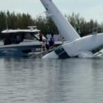 Bimini, The Bahamas: A Tropic Ocean Airways seaplane carrying eight American passengers and two crew members crashed into the water while preparing for departure from North Bimini, Bahamas, on August 1, with all 10 occupants rescued safely in an incident that is now under investigation by Bahamian authorities. According to the Royal Bahamas Police Force, the Cessna 208B Grand Caravan seaplane was departing from North Bimini for Fort Lauderdale, Florida, when the accident occurred shortly before takeoff. Police said the aircraft was taxiing on the water and attempting to line up for departure when it reportedly veered uncontrollably to the left. The pilot is said to have taken evasive action to avoid heavy boat traffic in the area, but the aircraft struck a dock before overturning and sinking in waters estimated to be about 100 feet (30 metres) deep. The aircraft was operated by Tropic Ocean Airways, a Florida-based seaplane carrier that provides scheduled and charter flights between South Florida, the Bahamas and other Caribbean destinations. The airline confirmed the aircraft was involved in an accident and said it is cooperating fully with the ongoing investigation. All eight passengers, identified only as American tourists, along with the two crew members, escaped the aircraft and were rescued safely. Nick Pavlakis, general manager of Marine Max in Jupiter and a rescue boat operator, witnessed the crash and quickly took action to help the eight passengers and two crew members on board. Authorities have not released the identities of the passengers or crew, and no injuries have been officially reported. The rescue began almost immediately as nearby boaters, marina personnel and bystanders rushed to assist those aboard. Witnesses helped evacuate the occupants from the overturned aircraft before emergency responders arrived at the scene. The Royal Bahamas Police Force later confirmed that everyone on board had been accounted for and rescued. Passenger Jeanne O'Brien, who was among those on board, told ABC News that the aircraft "went down pretty fast" after striking the dock. She said the passengers worked together to exit the cabin after the impact. Video recorded following the accident showed occupants in the water wearing life jackets as nearby vessels converged to assist. ABC News reported that the rescue was completed within minutes. Authorities have not determined the cause of the accident. Investigators are expected to examine the aircraft, pilot actions, operating conditions and other factors to establish why the seaplane lost directional control while taxiing for departure. No mechanical failure has been confirmed, and officials have not indicated whether weather or water conditions contributed to the accident. The Royal Bahamas Police Force is leading the initial investigation, while additional aviation authorities are expected to review the occurrence in accordance with international accident investigation procedures. Tropic Ocean Airways said it is providing full assistance to investigators and remains focused on supporting those affected. The accident resulted in substantial damage to the aircraft, which came to rest submerged after overturning. Recovery operations are expected to support the investigation into the sequence of events leading up to the crash. Further updates are expected once Bahamian investigators release additional findings or a preliminary accident report.