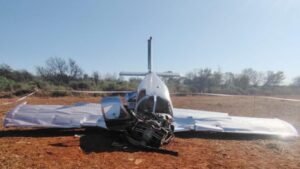 Fochville, South Africa: The preliminary accident report, released on 28 July 2026 by the Accident and Incident Investigations Division (AIID) of the South African Civil Aviation Authority (SACAA), found that the engine of a Bird Aviation Piper PA-28-180 registered ZS-ESZ was not producing power when the aircraft struck the ground near Fochville, Gauteng, on 27 June 2026. The report remains preliminary, with the investigation still ongoing and the AIID cautioning that its findings do not apportion blame or liability. According to the report, the operator was Bird Aviation, while the aircraft was being used under a hire-and-fly arrangement for hour-building. The operation was classified as Training under Part 91, and the aircraft belonged to the approved training organisation (ATO) from which it was hired. The accident involved two people, a 21-year-old Indian pilot and one passenger. Both were fatally injured and the aircraft was destroyed. The pilot held a valid Private Pilot Licence (PPL) and was building flight hours toward a Commercial Pilot Licence (CPL) through the ATO. The flight took place on the afternoon of 27 June 2026, when the pilot and passenger departed Lanseria International Airport (FALA) in Gauteng on an hour-building flight, intending to return to the same airport. The flight was conducted under visual meteorological conditions (VMC) and in accordance with Part 91 of the Civil Aviation Regulations. The flight had initially been planned for 0900Z, but departure was delayed because of persistent haze and low visibility. After conditions improved, the aircraft departed Runway 07 at 1325Z, as confirmed by an air traffic control officer at Lanseria. It then flew toward the Johannesburg General Flying Area (GFA), Flight Area Dangerous 182 (FAD 182). Multiple eyewitnesses later reported seeing the aircraft flying unusually low and performing unfamiliar manoeuvres. The aircraft subsequently flipped and began spinning to the left before impacting the ground. The crash occurred on a farm at Elandsfontein, south-east of Fochville, Gauteng, at coordinates 26° 35' 27.30" South, 27° 33' 41.24" East, with a field elevation of 5,124 feet. The accident was recorded at 1415Z. The pilot was a 21-year-old Indian national with a valid PPL. His licence was initially issued by the regulator on 25 May 2026 and was valid until 30 April 2027. His Class 2 aviation medical certificate was issued on 26 March 2025 and was valid until 31 March 2030. The report states that the aircraft type was endorsed on his licence and that he had no previous accidents recorded in relation to the investigation. The pilot had accumulated 132.2 total flight hours, including 19.4 hours in the previous seven days and 55.1 hours in the previous 90 days. He had flown 43.8 hours on the aircraft during the previous 90 days and had accumulated 122.7 hours on the Piper PA-28-180. The aircraft was a 1977-built Piper PA-28-180, a four-seat, single-engine, all-metal, low-wing aircraft with fixed tricycle landing gear. It was powered by a four-cylinder, naturally aspirated 180-horsepower Lycoming O-360-series engine. Its serial number was 28-3303, and it had accumulated 3,242.6 airframe hours by the time of the accident. The AIID found that the aircraft had valid registration and airworthiness documentation. Its current Certificate of Registration had been issued on 19 September 2025, while its latest Certificate of Airworthiness was valid until 31 October 2026. The aircraft underwent its mandatory periodic inspection on 13 March 2026 at 3,218.4 airframe hours, after which a Certificate of Release to Service was issued, valid until 12 March 2027 or 3,318.4 total airframe hours, whichever came first. The aircraft was maintained by an approved aircraft maintenance organisation whose certificate was valid until 30 June 2026. The organisation held Category A and Category C ratings for the aircraft's airframe and engine. The ATO's certificate had been renewed on 17 November 2025 and was valid until 28 February 2029. Fuel records showed that 111 litres of Avgas 100LL had been uplifted after the aircraft's flight on 26 June 2026, with the pilot refuelling the tanks before parking the aircraft. The Piper PA-28-180 has a fuel capacity of 189 litres, providing approximately six hours of endurance. The preliminary findings state that the aircraft departed Lanseria with full fuel tanks and no technical issues. However, fuel was found leaking from the aircraft after the accident. The report does not currently identify the fuel leak as the cause of the engine power loss. Weather conditions were favourable and were not considered a contributing factor. The 1400Z METAR from Lanseria recorded winds from 300° at 7 knots, CAVOK visibility, a temperature of 16°C, scattered clouds at 4,500 feet, a dew point of 5°C and QNH of 1026 hPa. The aircraft's navigation and communication equipment had no recorded defects before the flight. It was not equipped with a flight data recorder (FDR) or cockpit voice recorder (CVR), and the report states that neither was required for this aircraft type. The wreckage examination showed that the aircraft hit the ground in a steep nose-down attitude at high speed with little forward momentum. The debris was concentrated around the impact point, with a crater being the only ground scar identified. The aircraft came to rest facing south-east. Investigators found that the ailerons could not be moved and were both in the down position, while the elevator and rudder moved freely. The landing gear had broken and collapsed rearwards. Both wings suffered severe leading-edge damage and accordion-like deformation that ruptured the fuel tanks. The damage was consistent with heavy compressive loading during the steep, rapid-impact sequence. The top engine cowling had separated from the aircraft and was found approximately 10 metres ahead of the main wreckage. The engine cradle was deformed and the engine was facing slightly to the right. The propeller showed asymmetric damage, with one blade bent rearwards and the other showing little or no deformation. Neither blade displayed S-curve bending. The AIID said the damage pattern was consistent with the propeller being non-rotating at impact. This evidence, together with eyewitness accounts of the pilot apparently attempting to restart the engine, led investigators to conclude that the engine was not producing power at the time of impact. However, the preliminary report does not yet establish the underlying reason for the loss of engine power. The instrument panel was broken into multiple pieces, with several indicators dislodged from their original positions. The report does not provide a final interpretation of the instrument evidence at this stage. There was no evidence of a pre- or post-impact fire. Investigators considered the accident not survivable because of the extent of cockpit damage. Emergency responders reported that the pilot-in-command was not wearing his seat belt and was consequently thrown from the aircraft. Medical and pathological information is reserved for the final report. The aircraft was operating in the Johannesburg GFA within FAD 182, outside the Terminal Control Area. FAD 182 extends from the ground to Flight Level 100, or 10,000 feet, except where it intersects the TMA. Bird Aviation also used the Safely Track Me application to monitor flights. The system relied on the pilot's mobile-phone GPS signal. Tracking was active when ZS-ESZ departed Lanseria, but shortly after the aircraft exited the Johannesburg Special Rules Area West TMA, the phone stopped transmitting its GPS position and the aircraft could no longer be tracked through the application. The AIID's preliminary findings confirm that the pilot was qualified and medically fit for the flight, the aircraft was being used under a valid hire-and-fly arrangement for hour-building, the operator/ATO held a valid certificate, the aircraft had valid registration and airworthiness documentation, and its maintenance records were up to date. The investigation therefore establishes several key facts but has not yet determined the precise cause of the accident. The aircraft left Lanseria with full fuel and no known technical issues; the engine was not producing power at impact; weather was not a factor; and the aircraft entered a steep, high-speed descent before striking the ground. The AIID is continuing to examine other aspects of the accident that could have safety implications. No safety recommendations have been issued at this stage. The AIID said these will be addressed in the final report. The investigation was classified as a Category 1 accident. The AIID appointed an investigator-in-charge and a co-investigator, dispatched investigators to the site and notified the relevant states and organisations under South African regulations and ICAO Annex 13. The AIID will lead the investigation and issue the final report. The AIID has warned that the preliminary report is based on evidence gathered during an ongoing investigation and that information may change if additional evidence emerges. Accordingly, the current finding should be described as the engine not producing power at impact, rather than stating that investigators have already determined the cause of the engine power loss.