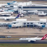 Sydney, Australia: The Australian Transport Safety Bureau (ATSB) on Friday, August 21, 2026, confirmed an investigation into a fourth ground-safety incident at Sydney Airport within just over three weeks, involving two Qantas aircraft that received potentially conflicting taxi instructions on August 18. The investigation, AO-2026-091, concerns an Airbus A321, registration VH-OGA, operating Qantas Flight QF405 to Melbourne, and a Boeing 737-838, registration VH-VXL, operating Qantas Flight QF589 from the Gold Coast. The ATSB's latest announcement said investigators will interview the air traffic controllers and flight crews involved, examine recorded data and collect other relevant evidence. The agency has not yet determined a cause or contributing factor and said a final report will be released after the investigation is completed. The August 18 event occurred at about 8:09 a.m. Australian Eastern Standard Time. After landing on Runway 34R, Qantas Boeing 737-838, QF589 taxied west on Taxiway Lima with clearance to turn right at Taxiway Bravo. At the same time, Qantas Airbus A321-271NY, QF405 was taxiing south on Taxiway Charlie after being cleared to turn right onto Taxiway Lima. As the A321 approached the taxiway, its crew saw the Boeing 737 approaching from the left and stopped the aircraft, allowing the 737 to pass. The ATSB classified the occurrence as an incident, with the aviation occurrence categories listed as failure to pass traffic and information/procedural error. There were no injuries or aircraft damage. The ATSB said there was “no immediate risk of collision” because QF405 braked normally before stopping. It nevertheless opened an investigation to understand the potential conflicting instructions given to the two crews. Airservices Australia said it reported the potential traffic conflict to safety authorities on Tuesday, August 18, and Qantas said its aircraft had been cleared to proceed in accordance with air traffic control instructions and that it would support the investigation. The latest event is the fourth Sydney Airport safety incident being investigated by the ATSB since July 27. Importantly, the ATSB has not found a common cause or fault in any of the four incidents at this stage. All four investigations remain active or pending, meaning claims that staffing shortages, training problems or the new Sydney Basin airspace changes caused the incidents would go beyond what the safety bureau has established so far. Airservices Australia has said the incidents involve different circumstances and that each is being examined on its individual facts. The first incident occurred on July 27, 2026, and is recorded by the ATSB as AO-2026-086 “Breakdown of coordination involving Bombardier DHC-8, VH-QOC, and Boeing 737, VH-XZG, at Sydney Airport.” The occurrence took place at 8:14 a.m. AEST and involved QantasLink Flight QLK424D, travelling from Canberra to Sydney, and Qantas Flight QFA124, travelling from Queenstown, New Zealand, to Sydney. ATC cleared the Boeing 737 to cross Runway 34L from Runway 25 while the QantasLink DHC-8 was still in its landing roll on Runway 34L. Controllers detected the developing conflict and alerted both crews, after which the 737 stopped beyond the runway holding point. The ATSB has classified the investigation as an active short occurrence investigation, with completion anticipated in Q4 2026. The second incident occurred on August 9 at about 7:20 a.m. and involved Jetstar Flight JQ402, an Airbus A320-232 registered VH-VQJ, and a Qatar Airways Boeing 777-300ER, registered A7-BEU, which was being towed by a tug. The ATSB's investigation number is AO-2026-087, titled “Taxiing proximity event involving Airbus A320-232, VH-VQJ and Boeing 777, A7-BEU, at Sydney Airport.” As the Jetstar aircraft taxied before departure for the Gold Coast, its crew saw the Qatar 777 in close proximity on a crossing taxiway. Both aircraft stopped abruptly, and a Jetstar cabin crew member was reported to have suffered a minor injury. No aircraft damage was reported. The incident triggered immediate scrutiny of ground operations. The Australian Transport Minister, Catherine King, said a ground controller and the tug operator were stood down for mandatory drug and alcohol testing, describing it as standard policy while the ATSB investigation was under way. “As is policy, the ground controller and tug operator have been stood down for mandatory drug & alcohol testing,” the minister's statement said. No passengers were injured, while the Jetstar crew member was assessed by paramedics. Only about three hours later, on the morning of August 9, Sydney Airport recorded its third incident in the sequence. The ATSB investigation, AO-2026-090, is titled “Runway incursion and rejected take-off involving Boeing 737-8SA, VH-IJQ, and Boeing 737-838, VH-XZH.” The aircraft were Virgin Australia Flight VA555, scheduled from Sydney to Perth, and Qantas Flight QF728, scheduled from Sydney to Ayers Rock Airport. At around 10 a.m., ATC cleared the Virgin Australia 737, registered VH-IJQ, for a full-length departure from Runway 34L. As the Virgin crew applied thrust, they saw the Qantas 737, registered VH-XZH, begin crossing the runway from Taxiway Lima. The Qantas crew reported that it had also received clearance from ATC to cross. The Virgin crew reduced thrust and stopped on the runway, while ATC simultaneously cancelled the take-off clearance. After the Qantas aircraft cleared the runway, the Virgin 737 was cleared to depart. The ATSB classified the occurrence as an incident involving information/procedural error, loss of separation, rejected take-off and runway incursion. No injuries or aircraft damage were recorded. The four incidents have also intensified scrutiny of Sydney's air traffic-control workforce and the major airspace changes introduced ahead of the opening of Western Sydney International Airport. CASA implemented the new Sydney Basin airspace arrangements on July 9, creating new controlled airspace around Western Sydney International and changing the structure around Sydney Kingsford Smith, Bankstown and Camden airports. CASA said the changes were designed to integrate the airports while maintaining capacity, efficiency and aircraft separation. Reuters reported that the ATSB had received a June report from an air traffic controller warning that staff at Sydney Airport were not adequately prepared for complex airspace and procedural changes linked to the opening of Western Sydney International Airport. The report cited concerns over limited training time and the volume of new material. CASA later found that Airservices Australia had implemented appropriate training, procedures and operational support arrangements. The sequence has also prompted warnings from aviation safety specialists. Retired commercial pilot and former ATSB safety investigator Geoff Klouth said the repeated events should be addressed quickly. “We've been very fortunate that there haven't been collisions, but it doesn't mean it won't happen in the future,” he said, warning that the consequences of a future failure could be catastrophic. For now, however, the official position remains that there is no established common cause behind the four incidents. The ATSB is examining each occurrence separately while also looking for common contributing factors. The July 27 coordination breakdown, the August 9 Jetstar-Qatar taxiing event, the August 9 Virgin-Qantas runway incursion and rejected take-off, and the August 18 Qantas taxiing conflict are all still under investigation. Until the ATSB releases its findings, staffing shortages, training pressures, airspace redesign and procedural errors should be treated as areas of concern or investigation rather than confirmed causes.
