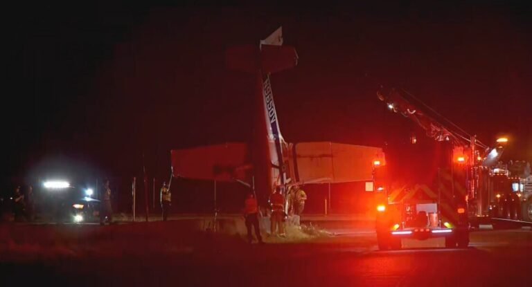 Layton, United States: Two people were hospitalized after a small aircraft crash-landed and overturned on a highway in Layton, Utah, late Thursday night, prompting a multi-agency emergency response and a federal investigation into the cause of the accident. According to the Layton Fire Department, crews were dispatched at approximately 11:57 p.m. on July 30 following reports of a plane crash near State Route 193 (Antelope Drive) and Fort Lane, close to Hill Air Force Base in Davis County. Emergency responders arrived to find the aircraft upside down after it came to rest on or near the roadway. The aircraft was carrying two occupants, both of whom were able to exit the aircraft on their own before first responders arrived. They were treated at the scene and transported to local hospitals with injuries that authorities described as non-life-threatening or stable. No injuries were reported on the ground. The Layton Fire Department, Layton Police Department, and North Davis Fire District responded to the scene and secured the area while paramedics treated the occupants. Firefighters also mitigated potential hazards associated with the overturned aircraft before the site was turned over to federal investigators. In an official statement, the Layton Fire Department said: "Both occupants self-extricated prior to emergency crews arriving and were transported to local hospitals." The department added that the crash remains under investigation by federal authorities. Authorities temporarily closed portions of State Route 193 to allow emergency operations and preserve the crash site for investigators. The aircraft remained at the location overnight while documentation and recovery efforts were carried out. A nearby resident told local media the aircraft appeared to descend unusually low before impact. Eyewitness video circulating online reportedly captured the airplane's final moments before the crash, with witnesses suggesting the engine sounded abnormal just before the aircraft struck the ground. However, officials have not confirmed any mechanical problem or engine failure, and no cause has been determined.