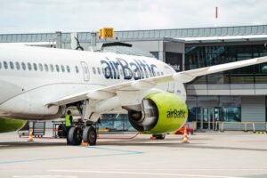 New York, United States: Latvia’s national airline airBaltic voluntarily filed for protection under Chapter 11 of the US Bankruptcy Code in New York on 14 September 2026, seeking to restructure its debt after soaring jet fuel costs and stalled negotiations with creditors pushed the carrier into acute financial stress. The airline said it had secured a commitment for €350 million ($405 million) in financing from Strategic Value Partners, Barclays, Hayfin Capital Management, Morgan Stanley and Oaktree Capital Management to support operations during the restructuring. The financing carries an interest rate of about 12% and remains subject to court approval. AirBaltic said it expects the court-supervised restructuring to be completed by June 2027, while flights will continue as scheduled. The filing comes as the aviation industry faces severe pressure from the Iran war that has doubled jet fuel prices and triggered the sector’s worst crisis since the COVID-19 pandemic. AirBaltic’s board said in a bankruptcy-court filing that the airline was experiencing “acute financial stress due to a combination of financial and geopolitical factors.” AirBaltic had been negotiating with creditors to secure additional financing, but the talks failed to produce an agreement. Before the bankruptcy filing, bondholders were due to vote on a proposal to raise up to €257 million through new super-senior debt due in February 2027, carrying an interest rate of 25%. Latvian Prime Minister Andris Kulbergs said bondholders representing more than 70% of the value of the airline’s debt chose liquidation instead of approving the financing required to keep the company going. “I view this solution as one of the best options for ensuring airBaltic’s viability, as it provides the necessary tools and time to implement the restructuring plan,” Kulbergs said. The Latvian government is continuing to search for a strategic investor while airBaltic reduces its fleet and reorganises its financial obligations. AirBaltic’s financial problems had been building before the latest fuel shock. The airline said it had about $583 million in funded debt and finance lease liabilities, while it owed €106 million in payroll taxes, airline taxes and fees. The carrier generated about €779 million in revenue in 2025. Kulbergs said airBaltic had “burned through” €380 million raised through bonds issued in 2024 by April 2026. A €30 million emergency government loan provided to the airline ran out in June. The airline had also attempted to lease out excess aircraft as it sought ways to improve its financial position. AirBaltic had previously planned to expand its fleet to 100 aircraft. However, the company’s growth strategy was hit by the loss of potential transit traffic from Russia, Belarus and Ukraine through Riga, while higher fuel costs made its financial position more difficult to sustain. Aviation analyst Simonas Bartkus said, “This is no longer available, and the company became too large for its market. The rise in fuel costs made the situation acute, they had no time to find a solution.” Kulbergs said, “Serving Baltic and Latvian routes requires only 30 aircraft, not 100.” AirBaltic currently operates about 50 Airbus A220-300 aircraft. As part of the Chapter 11 process, the airline plans to cancel or defer outstanding deliveries from a $3.5 billion order for 40 additional Airbus aircraft. It also plans to address $106.7 million worth of additional aircraft engines ordered from Pratt & Whitney. AirBaltic said it had already begun discussions with Airbus about deferring additional aircraft deliveries beyond 2026. Airbus did not immediately respond to Reuters’ request for comment, while RTX, the parent company of Pratt & Whitney, declined to comment. AirBaltic employs more than 3,000 people and has been expanding its global workforce for about a decade. CEO Erno Hilden said the airline was in talks with labour unions about “an adjustment in the workforce”, which he described as a natural consequence of the carrier’s existing capacity-reduction plans. Hilden said the largest operational changes during the Chapter 11 restructuring would involve reducing airBaltic’s wet-lease business, under which the airline provides aircraft and crews to other carriers for a fee. Despite the financial difficulties, Hilden said he remained confident about the underlying business. “I do think that the underlying business for airBaltic is a very healthy one. So after we really execute on our new business plan, I do see a bright future for the company,” he said. AirBaltic said the Chapter 11 filing is intended to provide protection from creditors while it negotiates a restructuring of its debt. The airline has said its flights will continue to operate as scheduled throughout the court-supervised process. The restructuring is expected to be completed by June 2027. Hilden, who previously led Scandinavian airline SAS through its own Chapter 11 restructuring between 2022 and 2024, said airBaltic is “targeting the same process”. The Latvian government remains the majority owner of airBaltic, while Germany’s Lufthansa holds a 10% minority stake. The government is continuing to seek a strategic investor as the airline restructures its debt, reduces its fleet and adjusts its operations. AirBaltic’s Chapter 11 filing makes it the second airline casualty linked to the economic impact of the Iran war after Spirit Airlines, although Spirit had entered bankruptcy months before the conflict began. The immediate challenge for airBaltic is to stabilize its finances while maintaining its network and operations. The airline now has until the planned completion of the Chapter 11 process in June 2027 to implement its restructuring plan, reduce costs and establish a more sustainable financial structure.